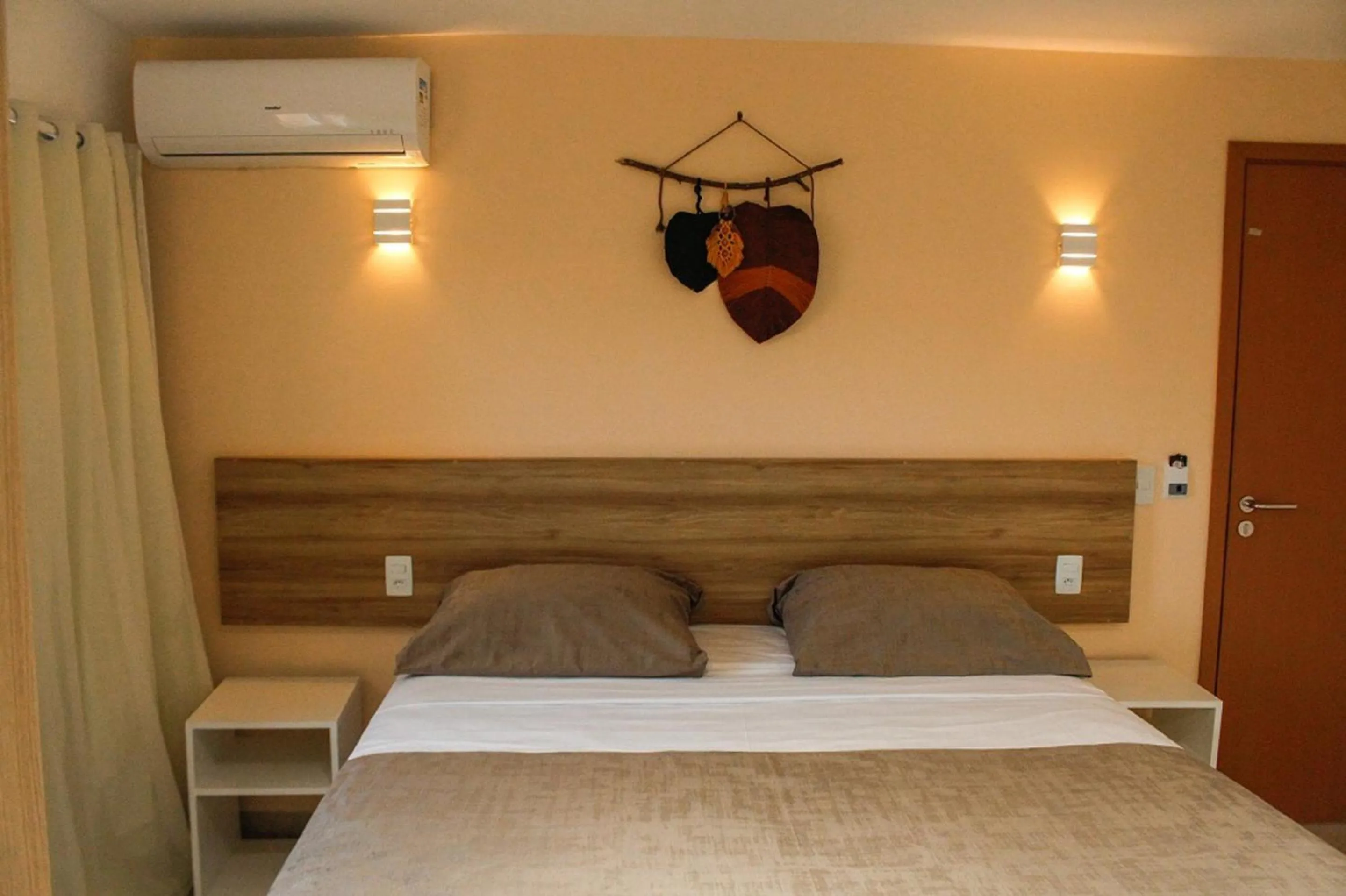 Bed in Pousada Jardins Tropical