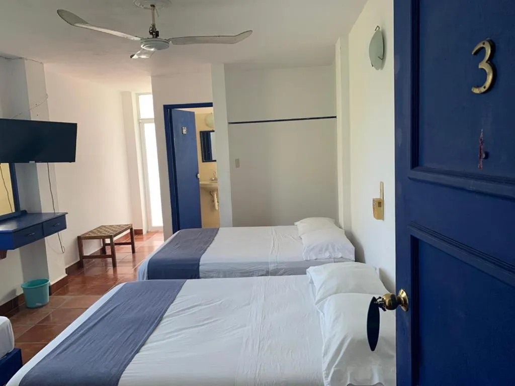 Photo of the whole room, Bed in MayFlower Hotel & Hostal