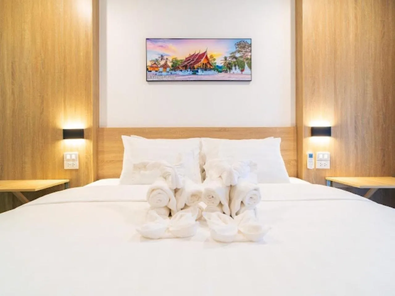 Bed in New Champa Boutique Hotel