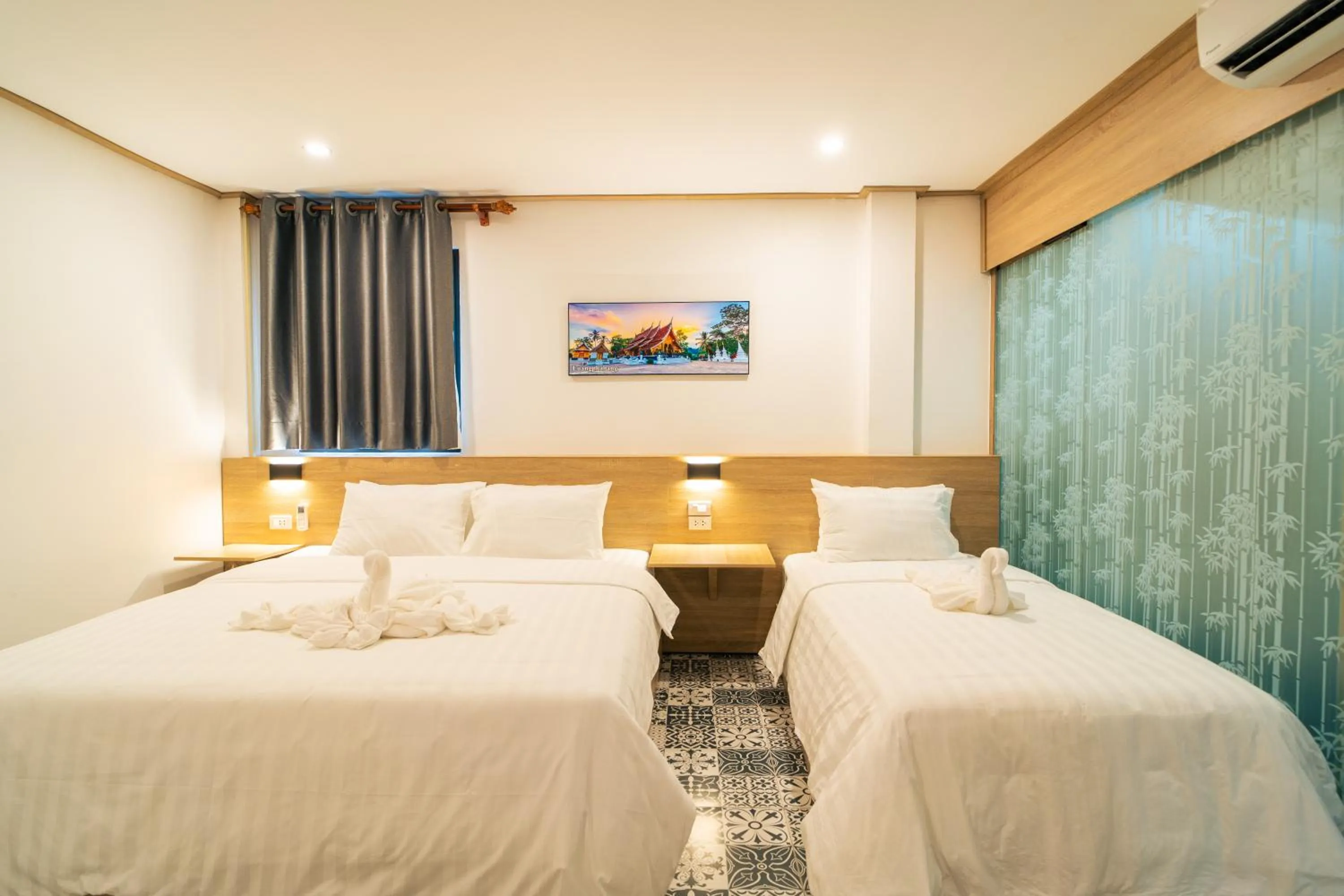 Bed in New Champa Boutique Hotel