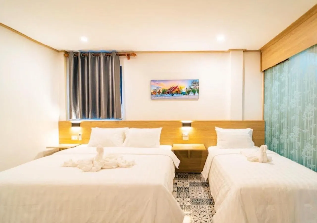 Bed in New Champa Boutique Hotel