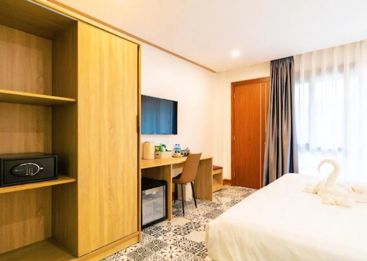 Bed in New Champa Boutique Hotel