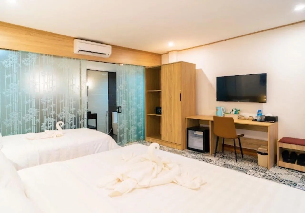 Bed in New Champa Boutique Hotel