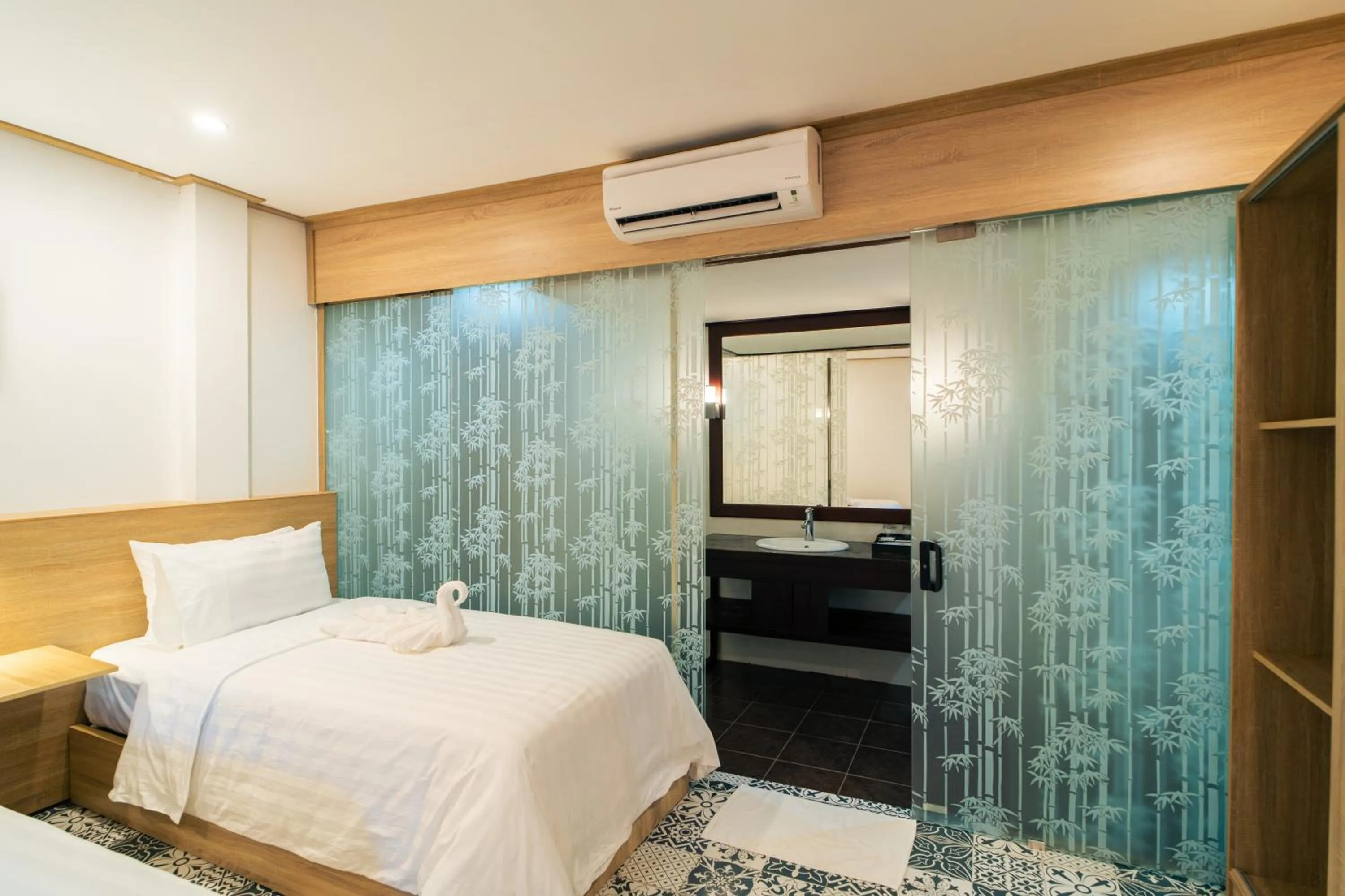 Bed in New Champa Boutique Hotel