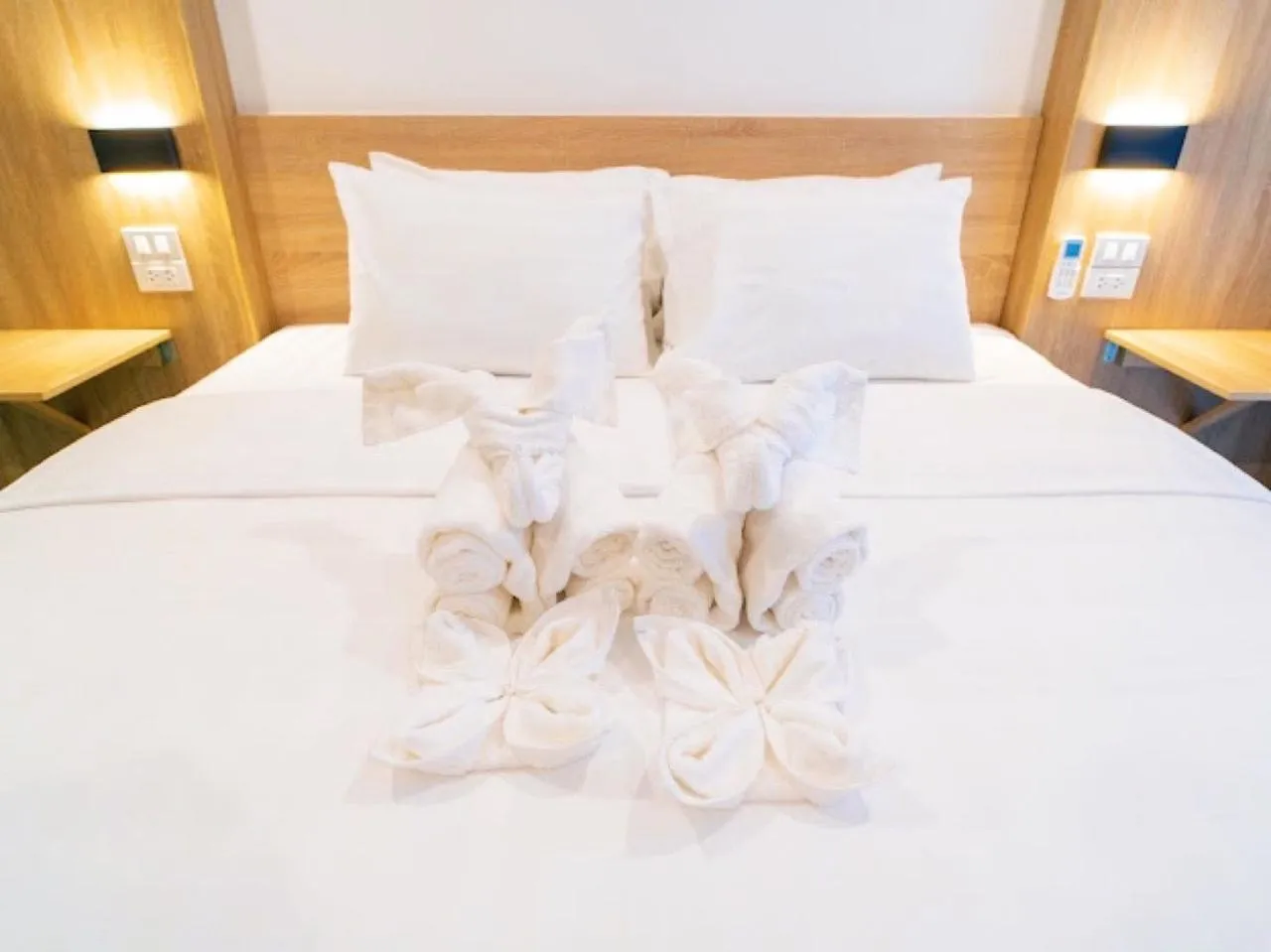 Bed in New Champa Boutique Hotel