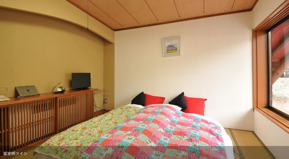 Bed in Tsubame Highland Lodge燕ハイランドロッジ