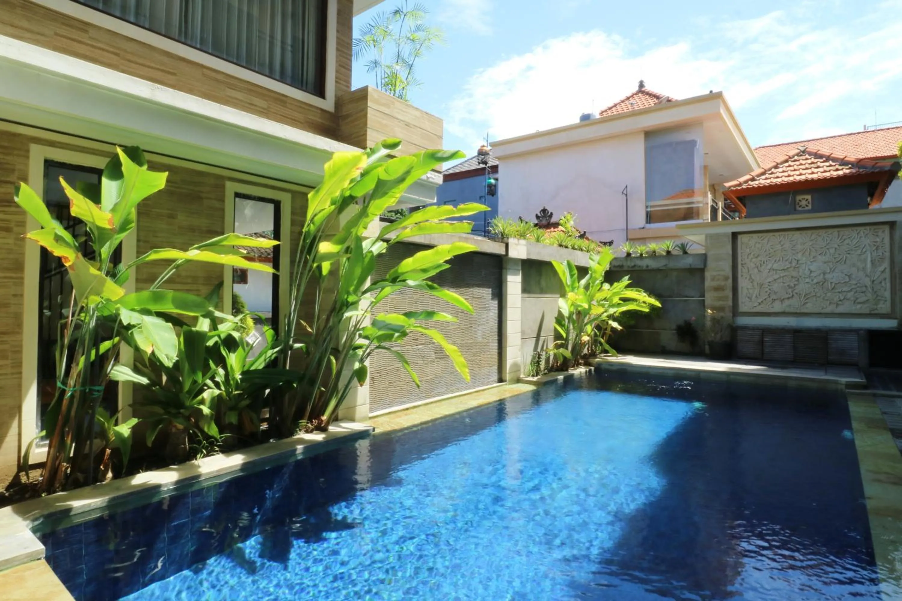 Swimming pool in Kondra Premiere Guest House Kuta