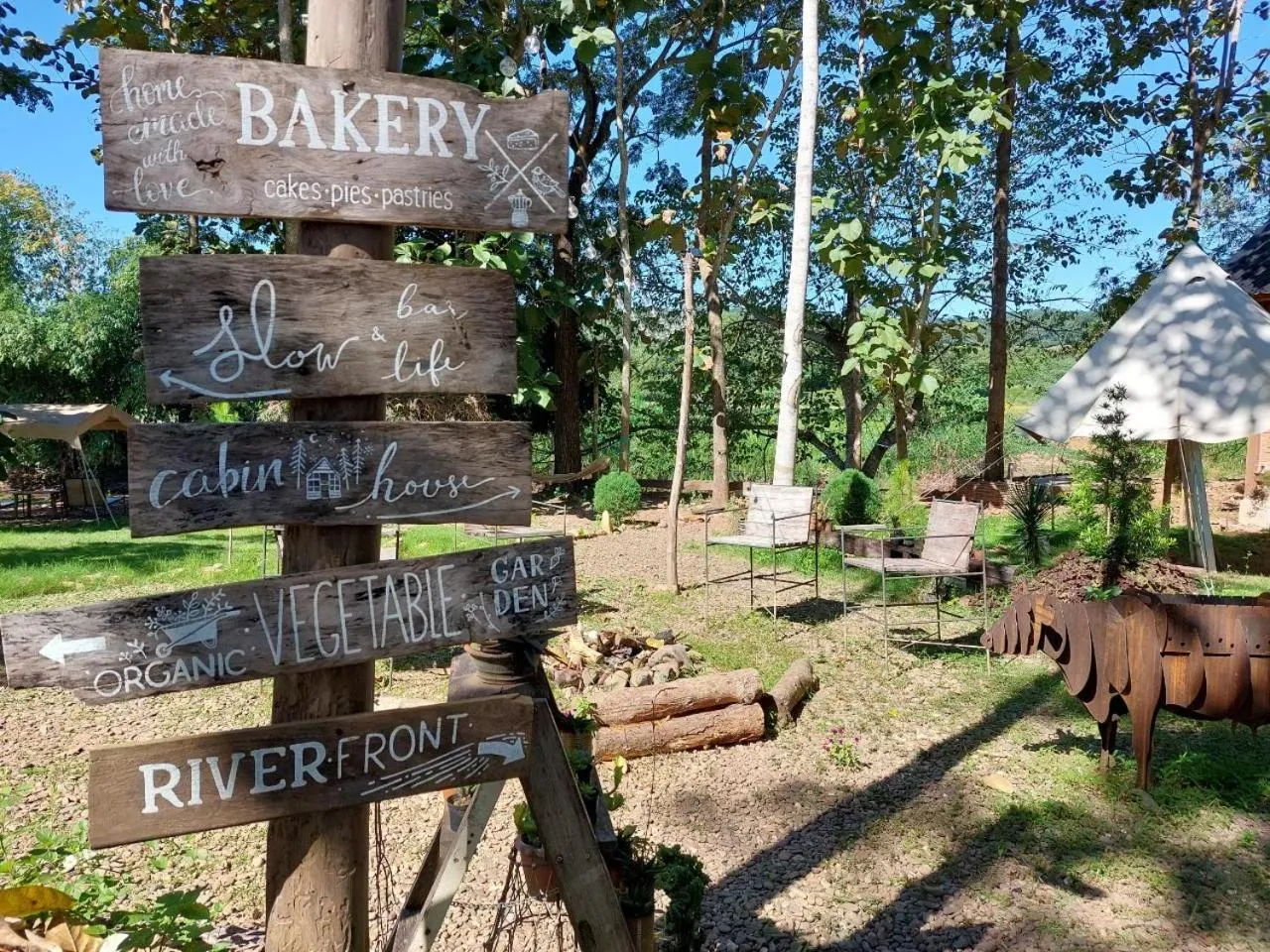 Property logo or sign in THE RIVER RUNS CHIANG KLANG