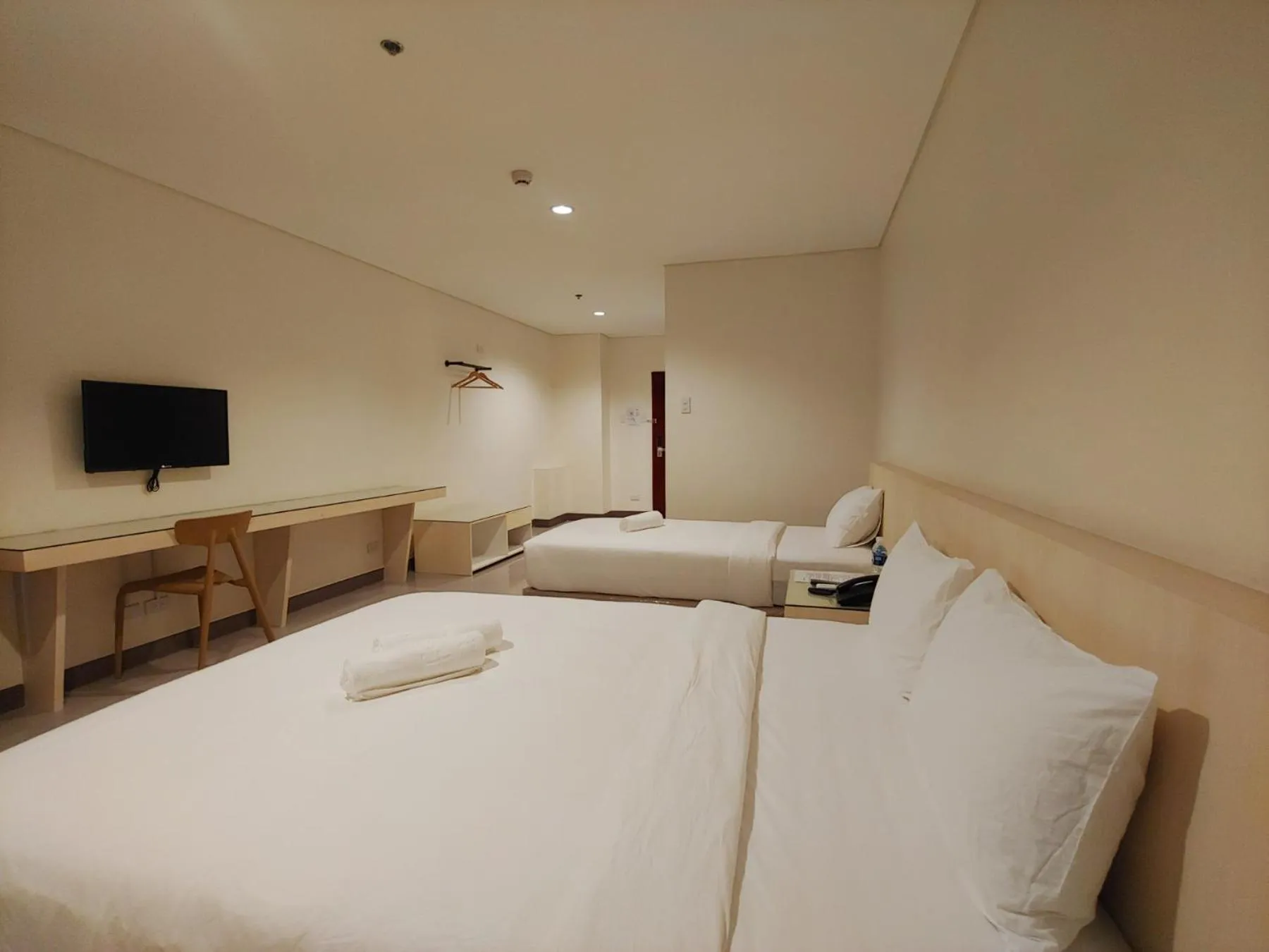 Photo of the whole room, Bed in Kaizen Suites