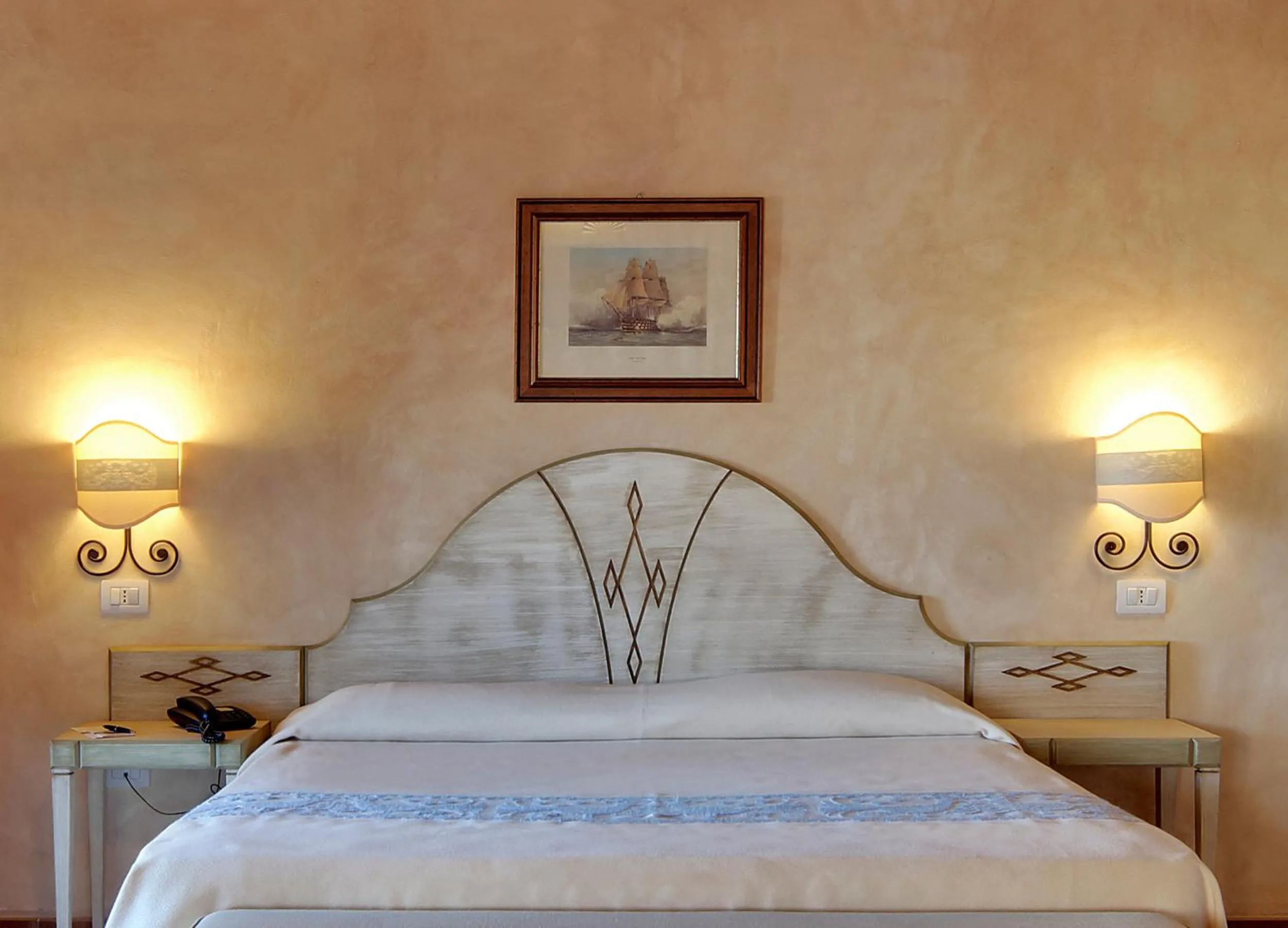 Bed in COLONNA RESORT, a Colonna Luxury Beach Hotel, Porto Cervo