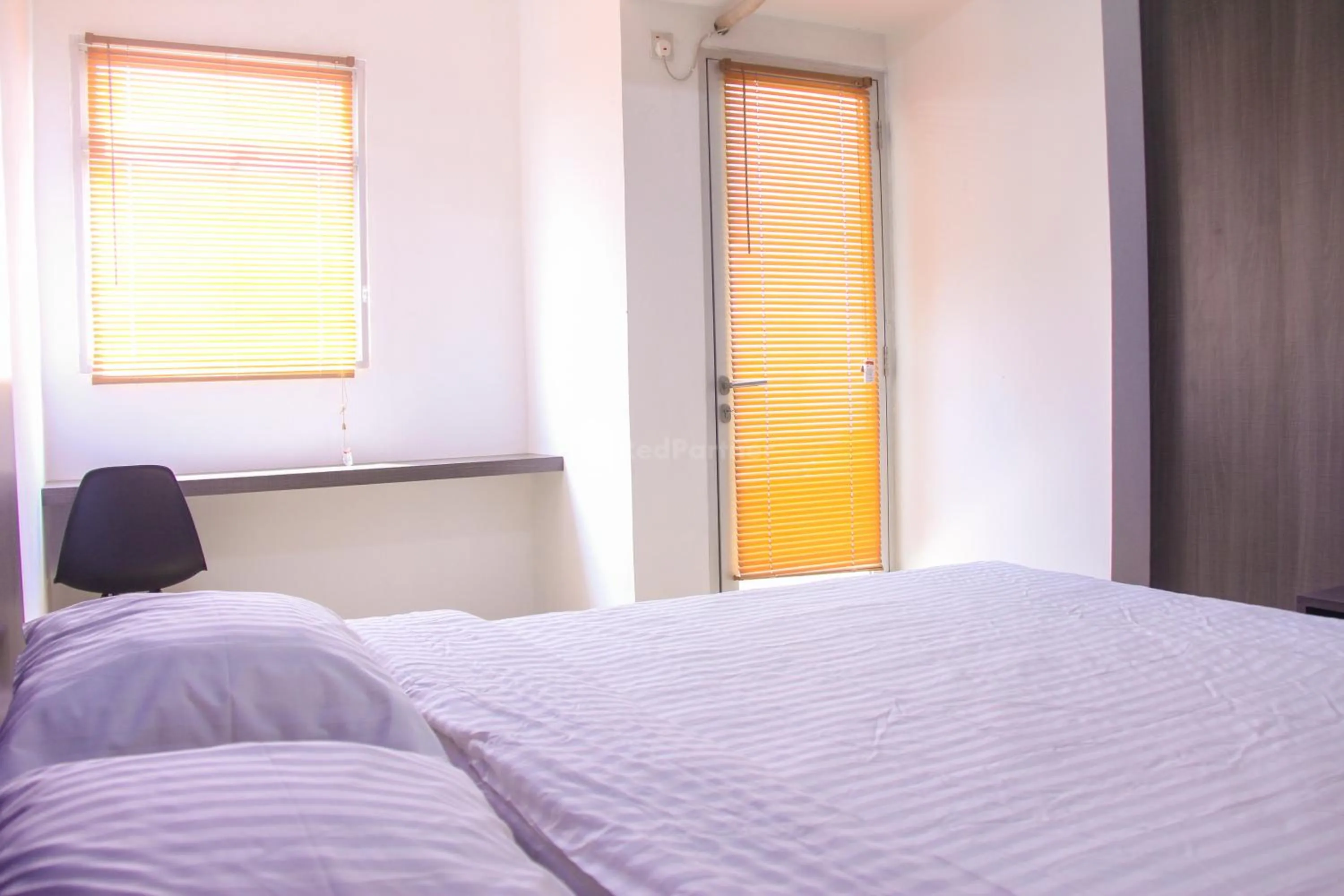 Bedroom in RedLiving Apartemen Gunung Putri Square - Abidin Room Tower Pinus