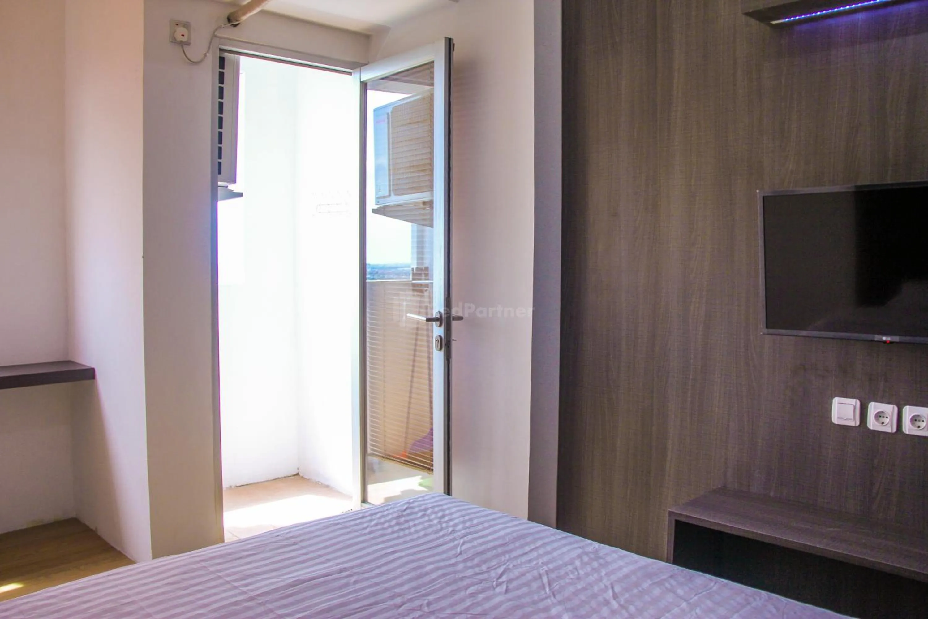 Bedroom in RedLiving Apartemen Gunung Putri Square - Abidin Room Tower Pinus