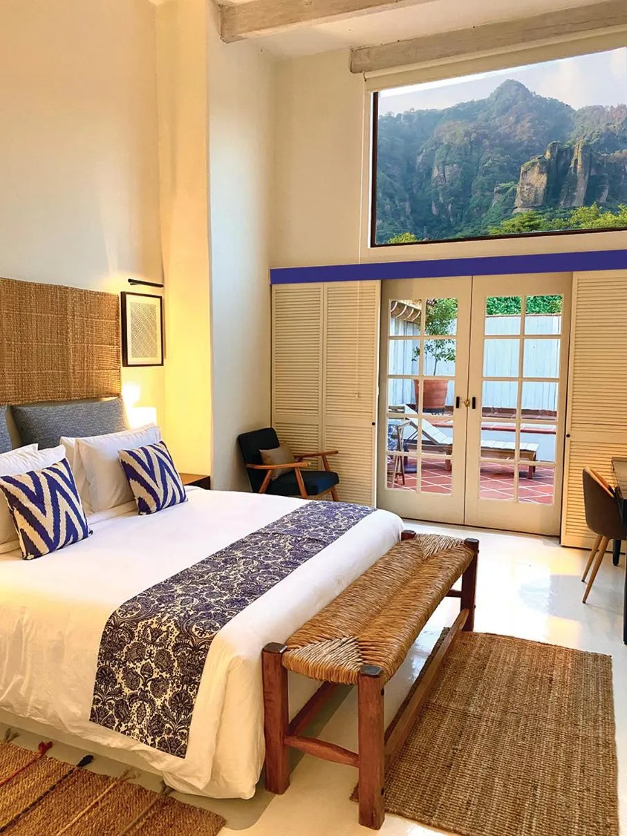 Bed in Hotel El Ciruelo, Tepoztlán