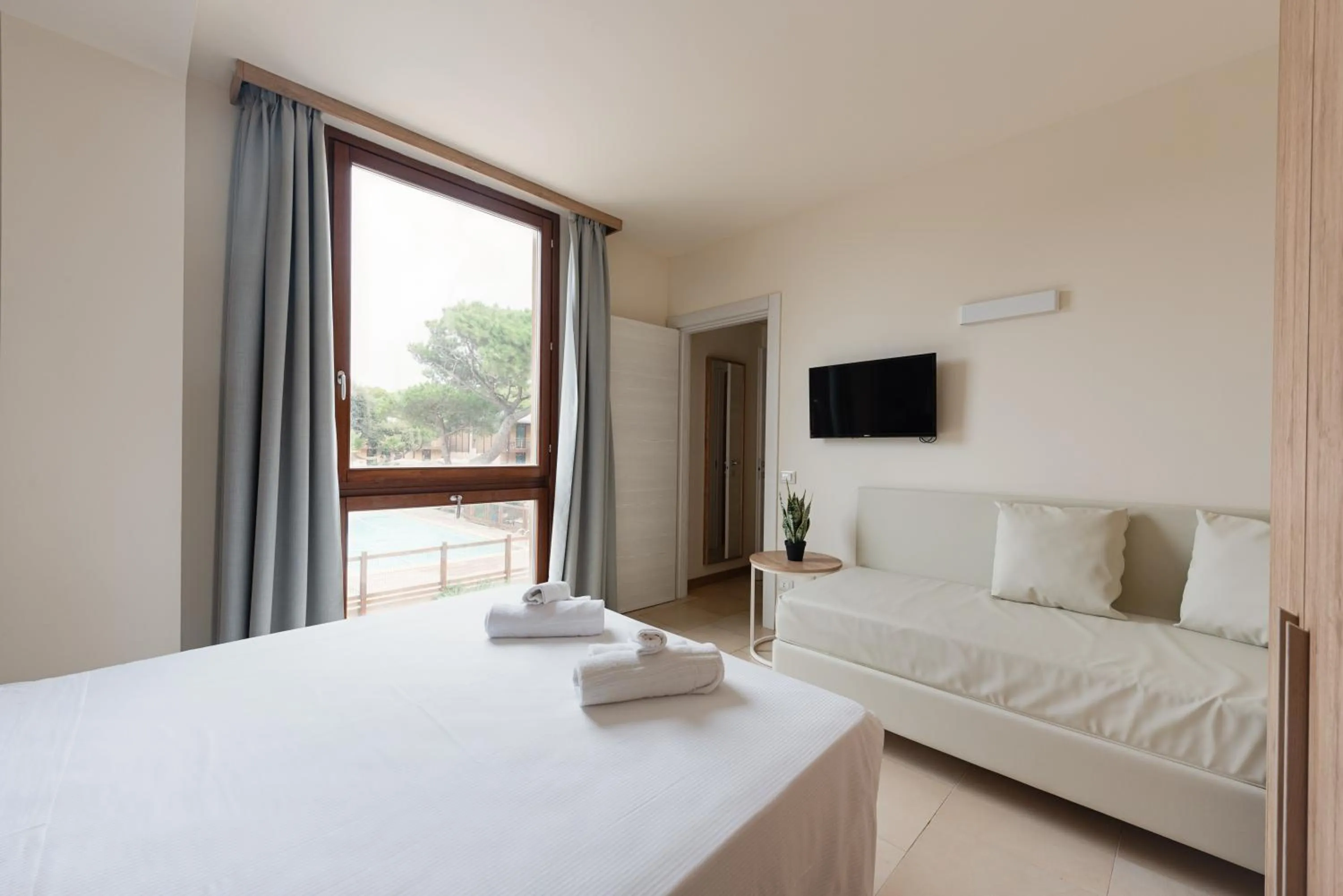 Bed in Canado Family Hotel