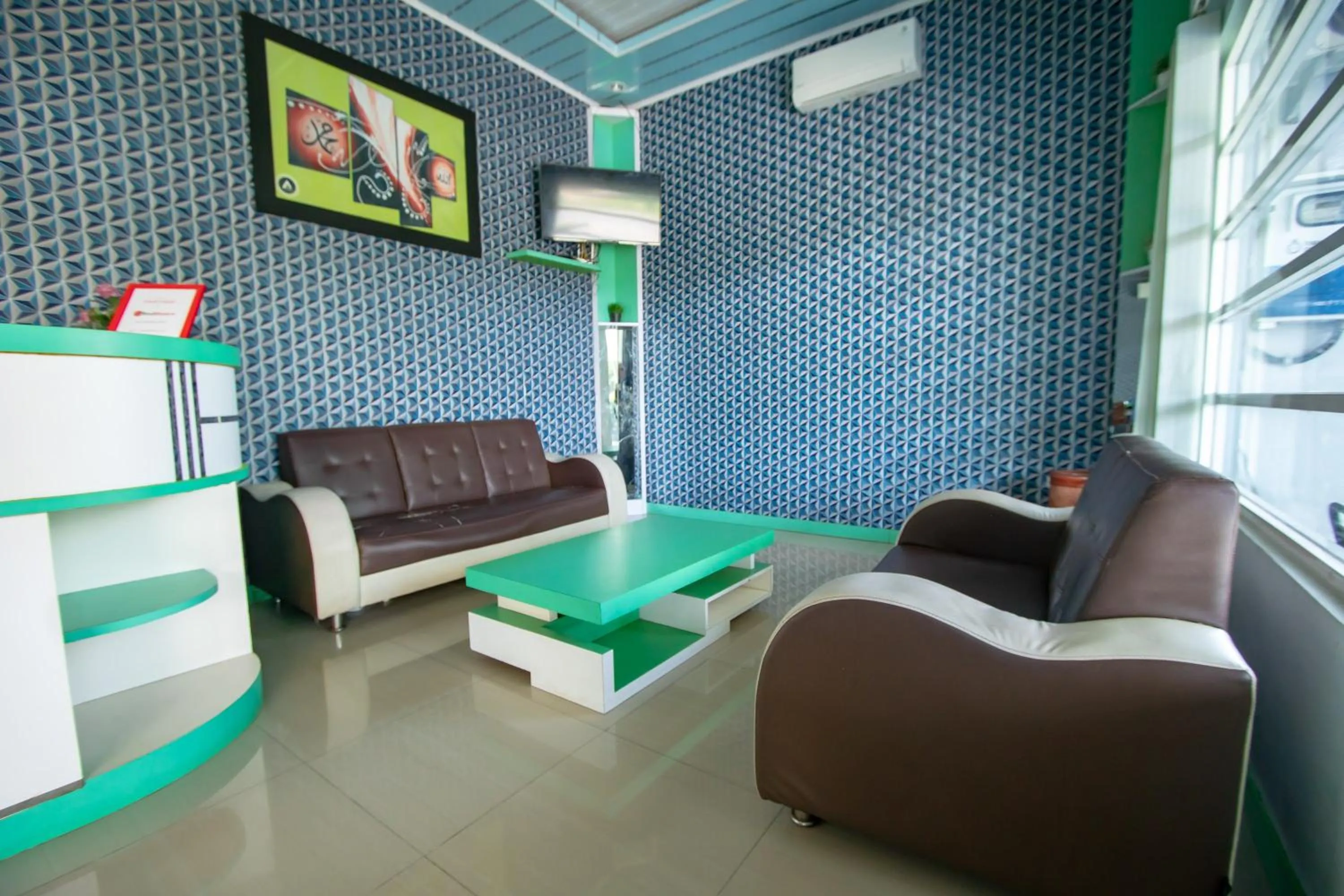 Living room in RedDoorz Syariah near Pantai Bali Abdya Blang Pidie