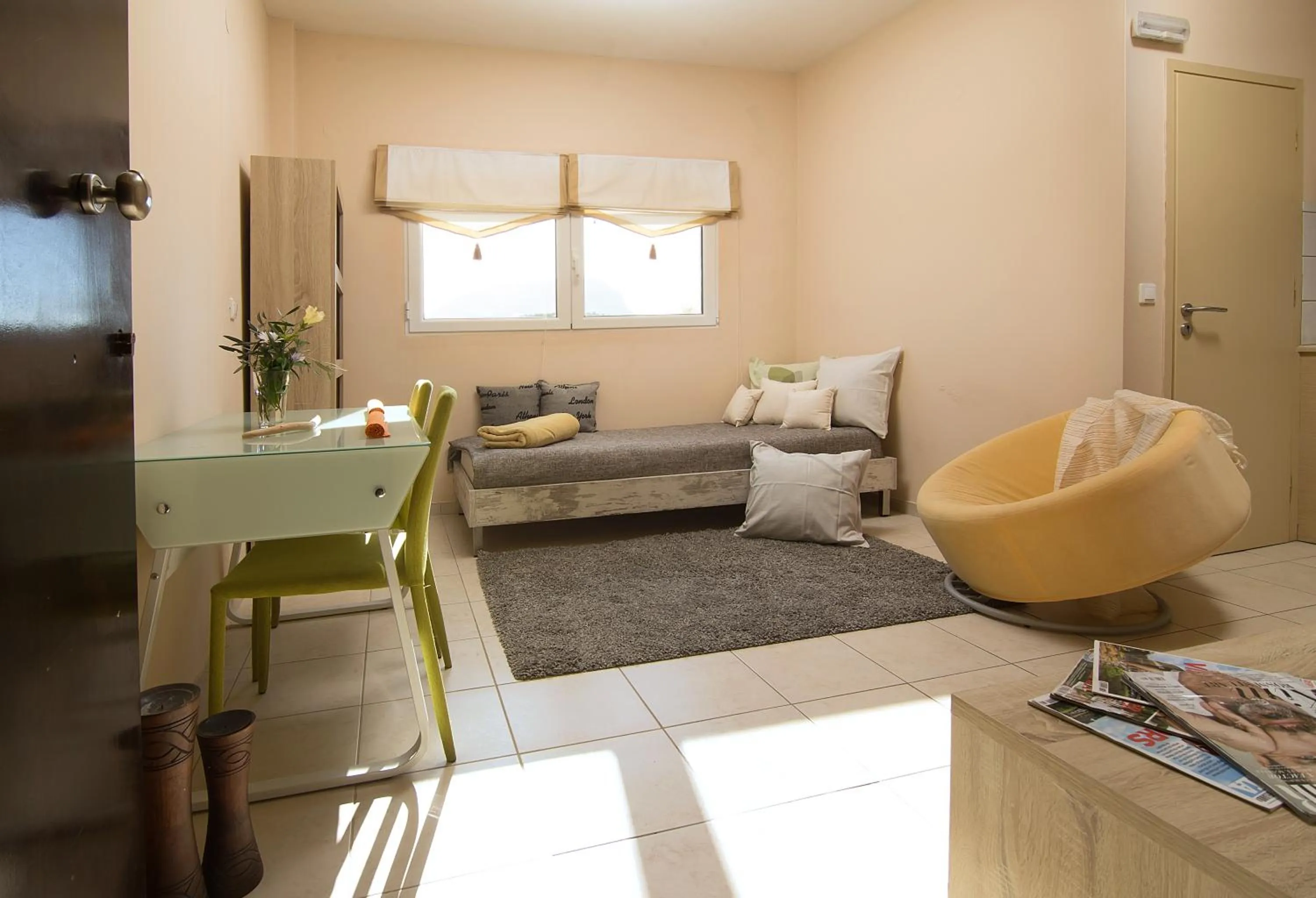 Living room, Bed in Home Suites