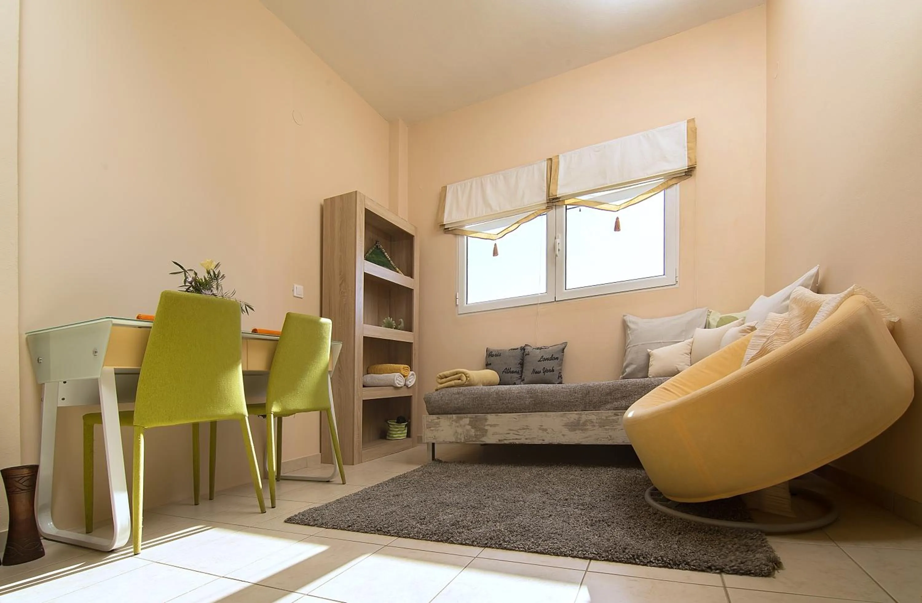 Living room, Bed in Home Suites