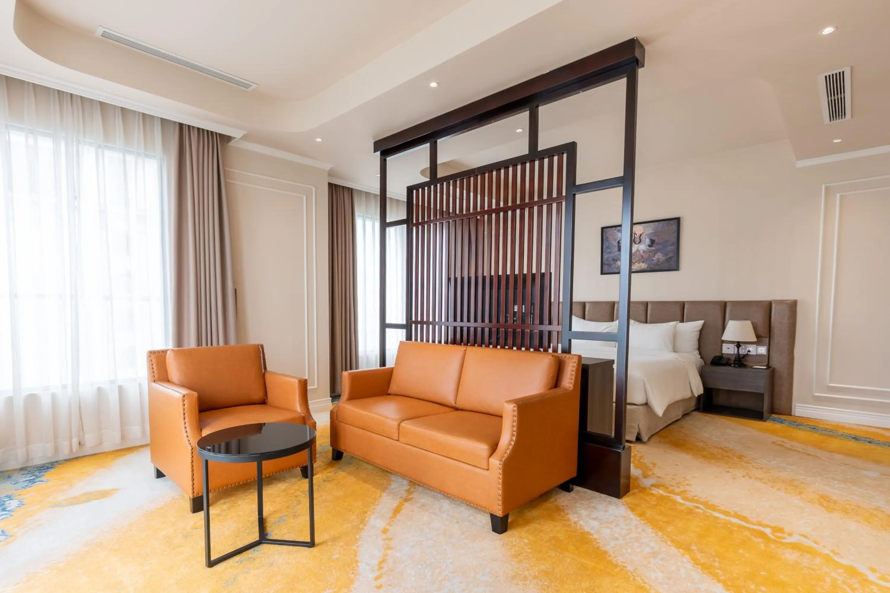 Seating area, Bed in La Vela Hue Hotel