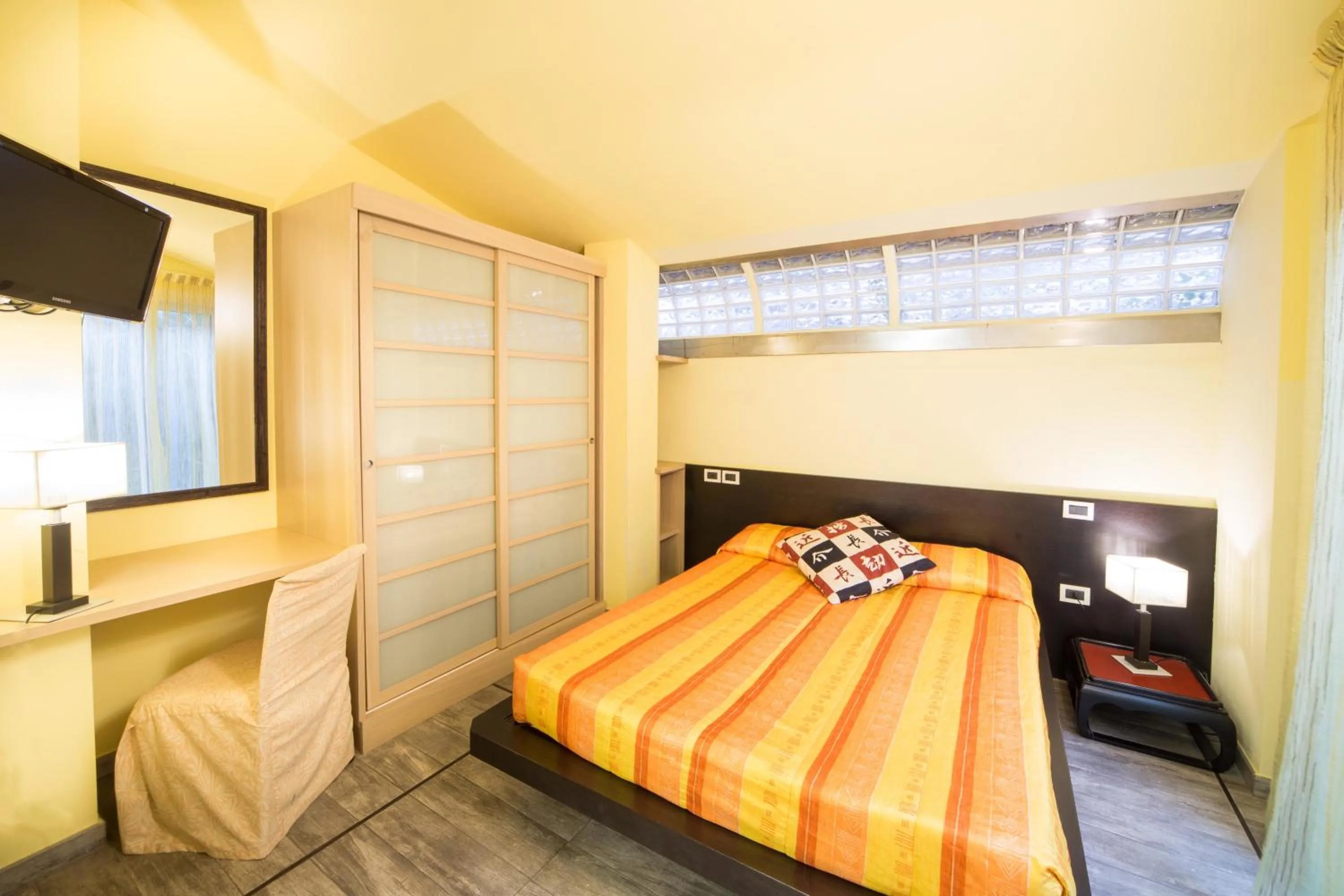 Bed in World Village Apartments