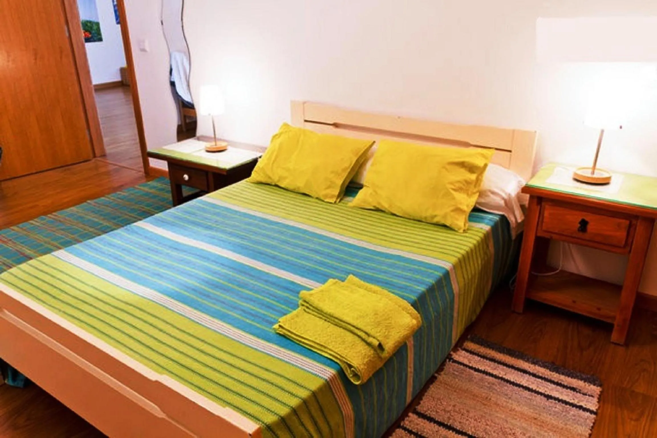 Photo of the whole room, Bed in Coloured Studio