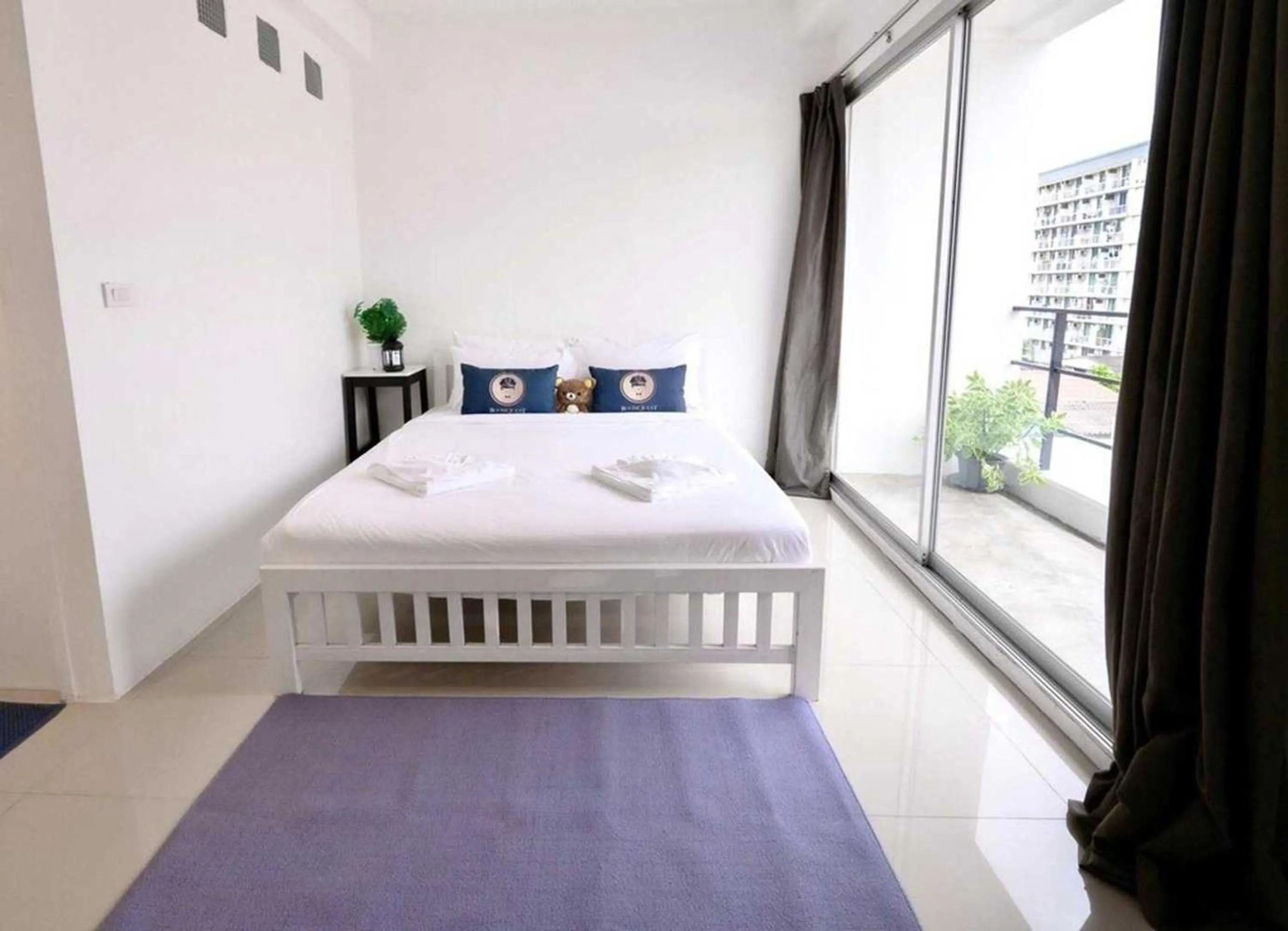 Bed in RQ Bangkok Sukhumvit 50 by Collection O