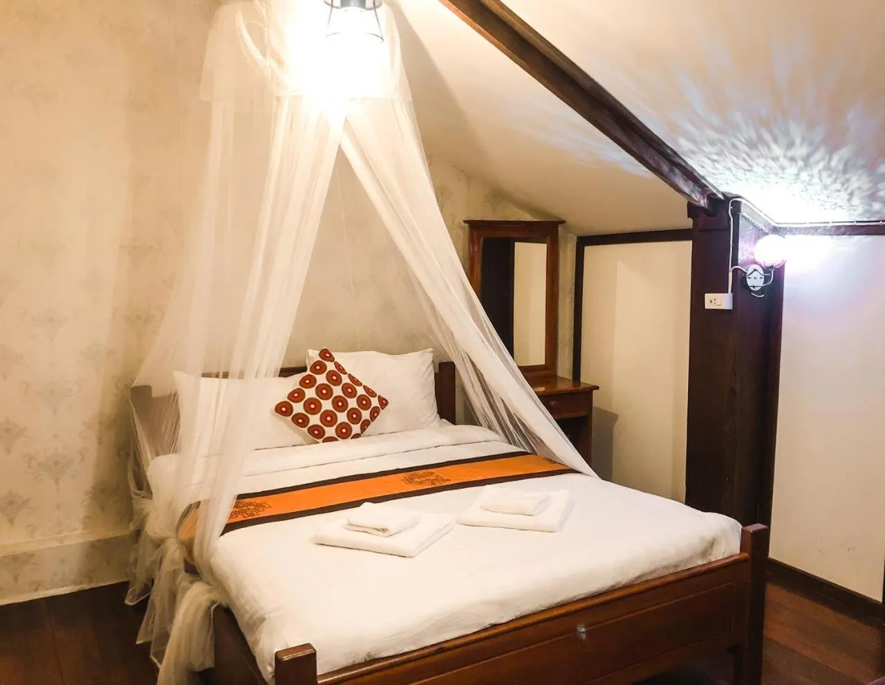 Bed in Ananta Hotel Luangprabang