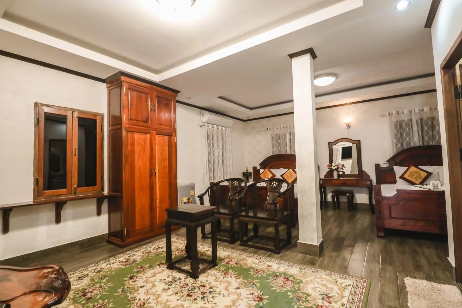 Seating area, Bed in Ananta Hotel Luangprabang