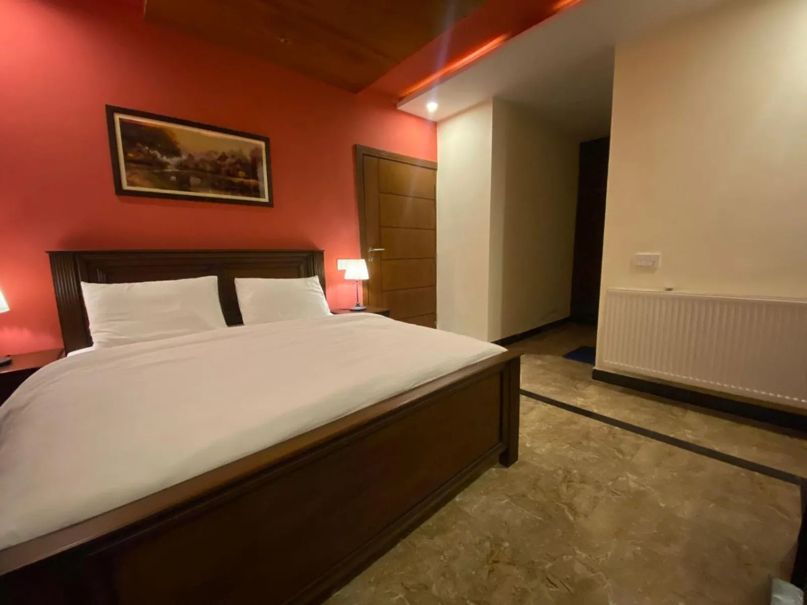 Bed in AK Hotel & Suites