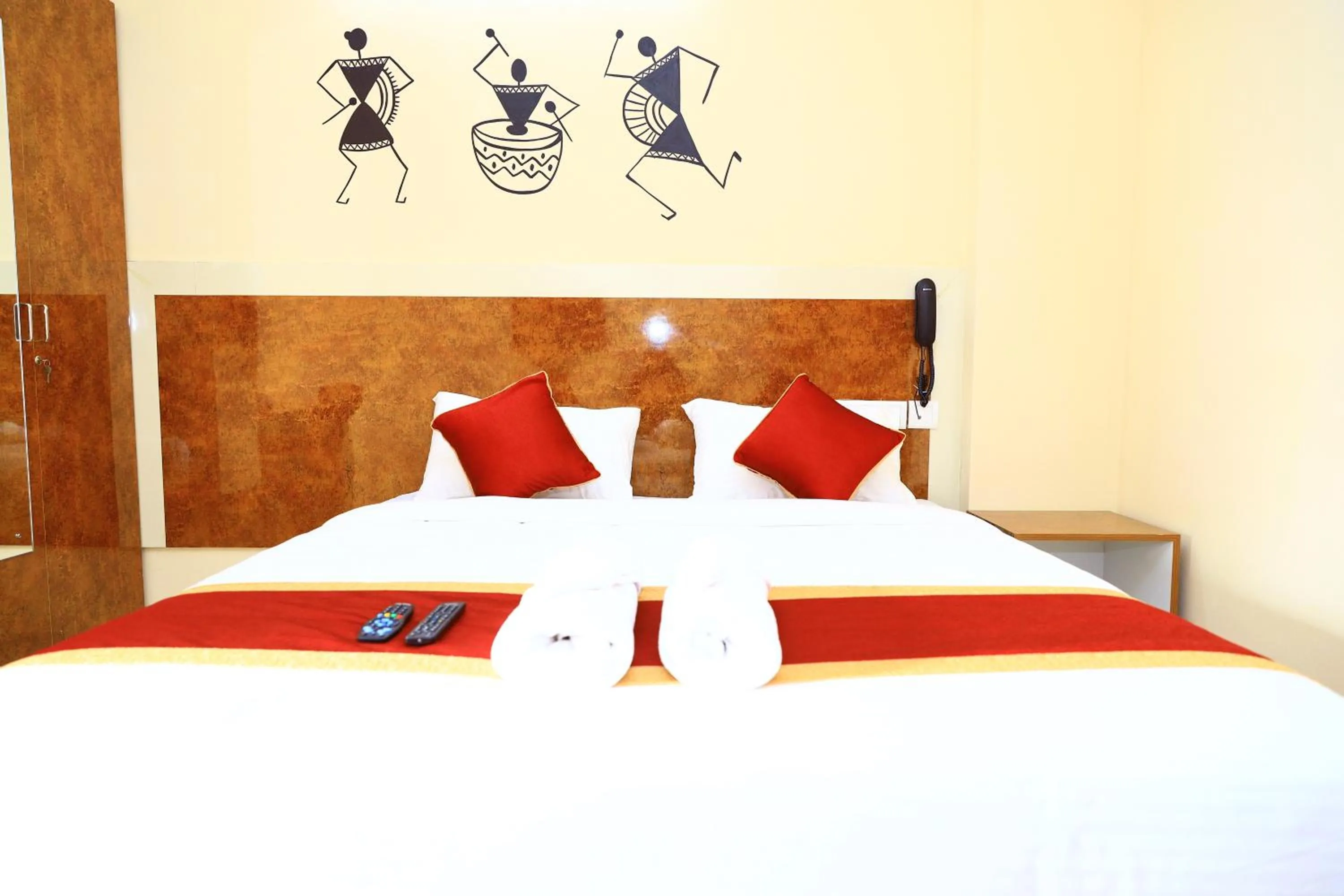 Bed in Sasthi Suites