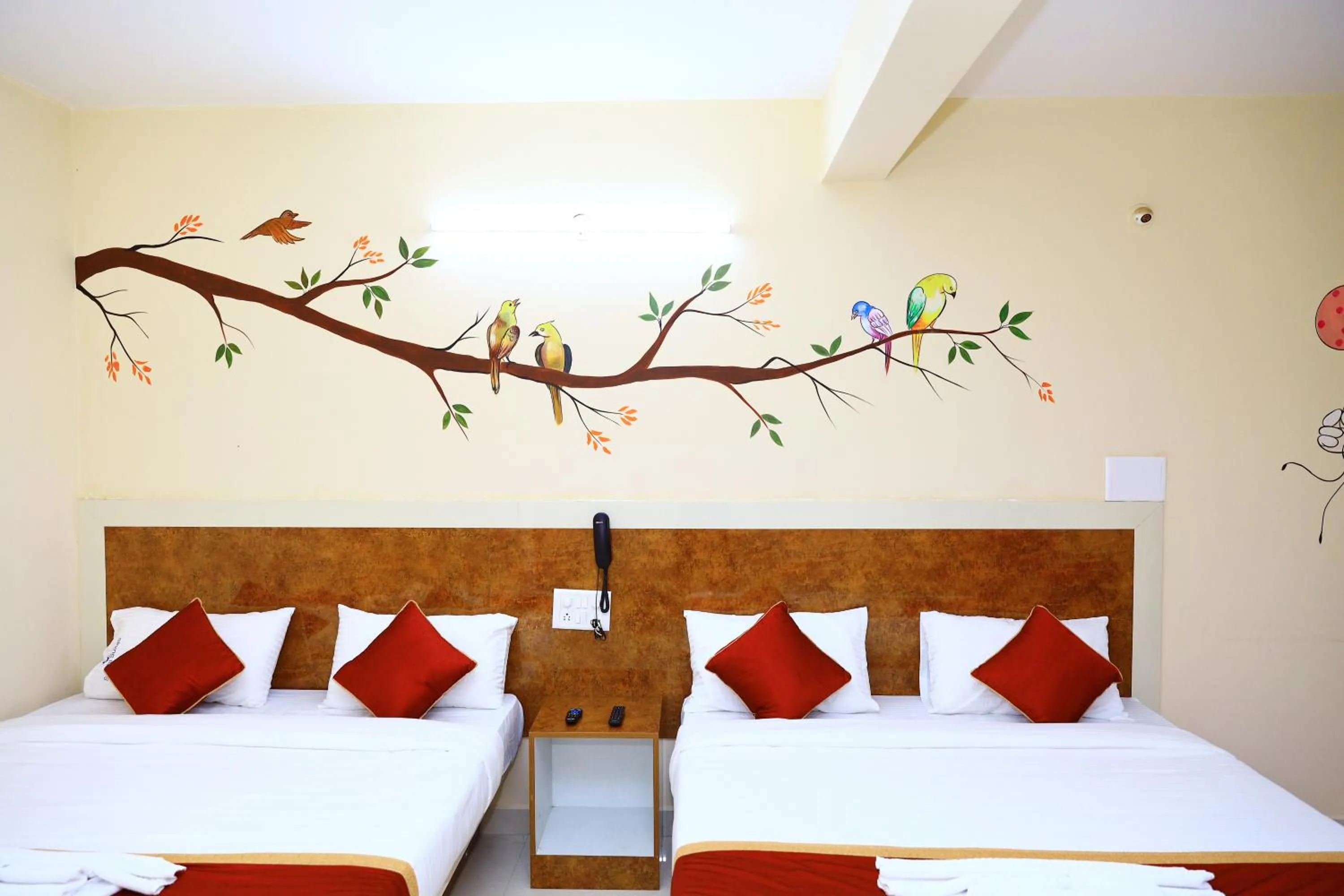 Bed in Sasthi Suites