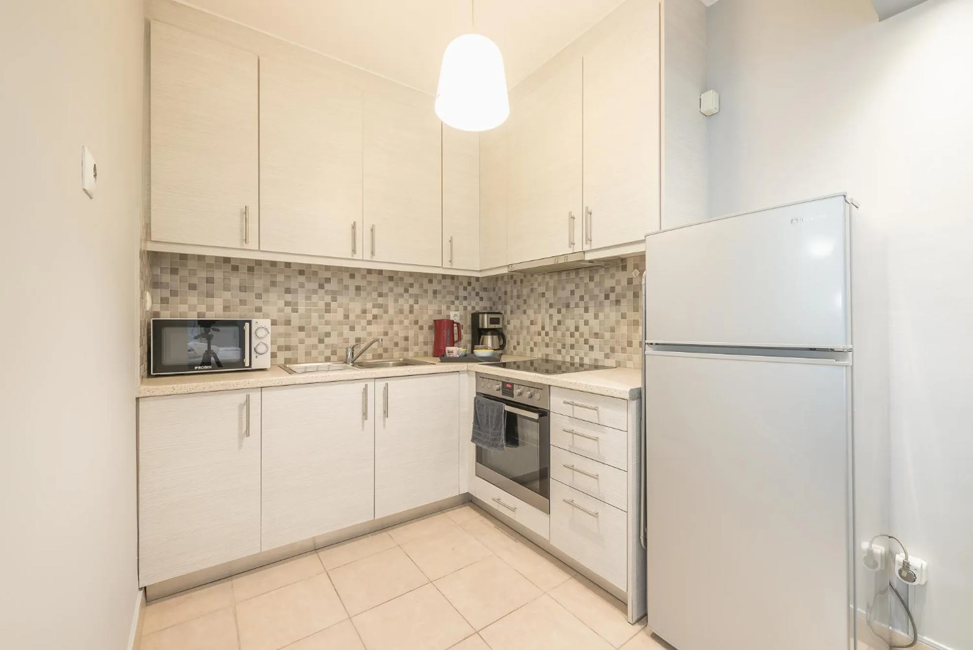 Kitchen or kitchenette in The Boutique Studio by CloudKeys