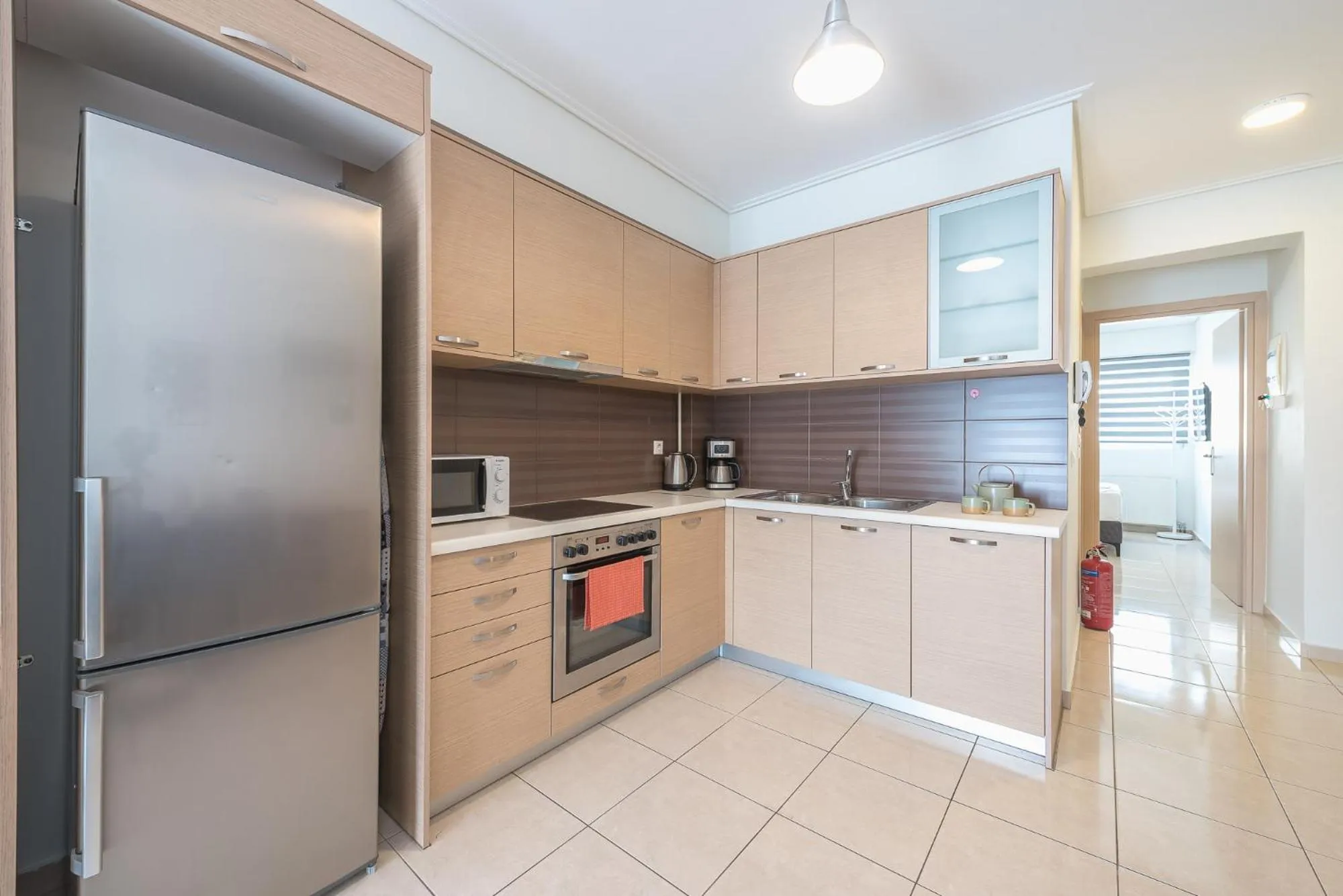 Kitchen or kitchenette in Elegant Home with Balcony by CloudKeys