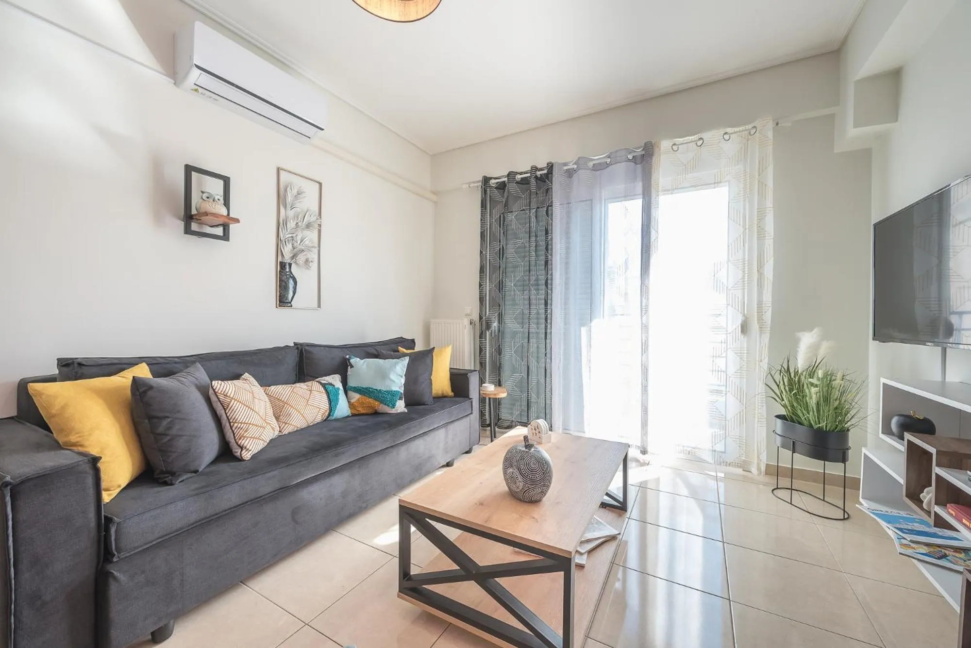 TV and multimedia in Elegant Home with Balcony by CloudKeys