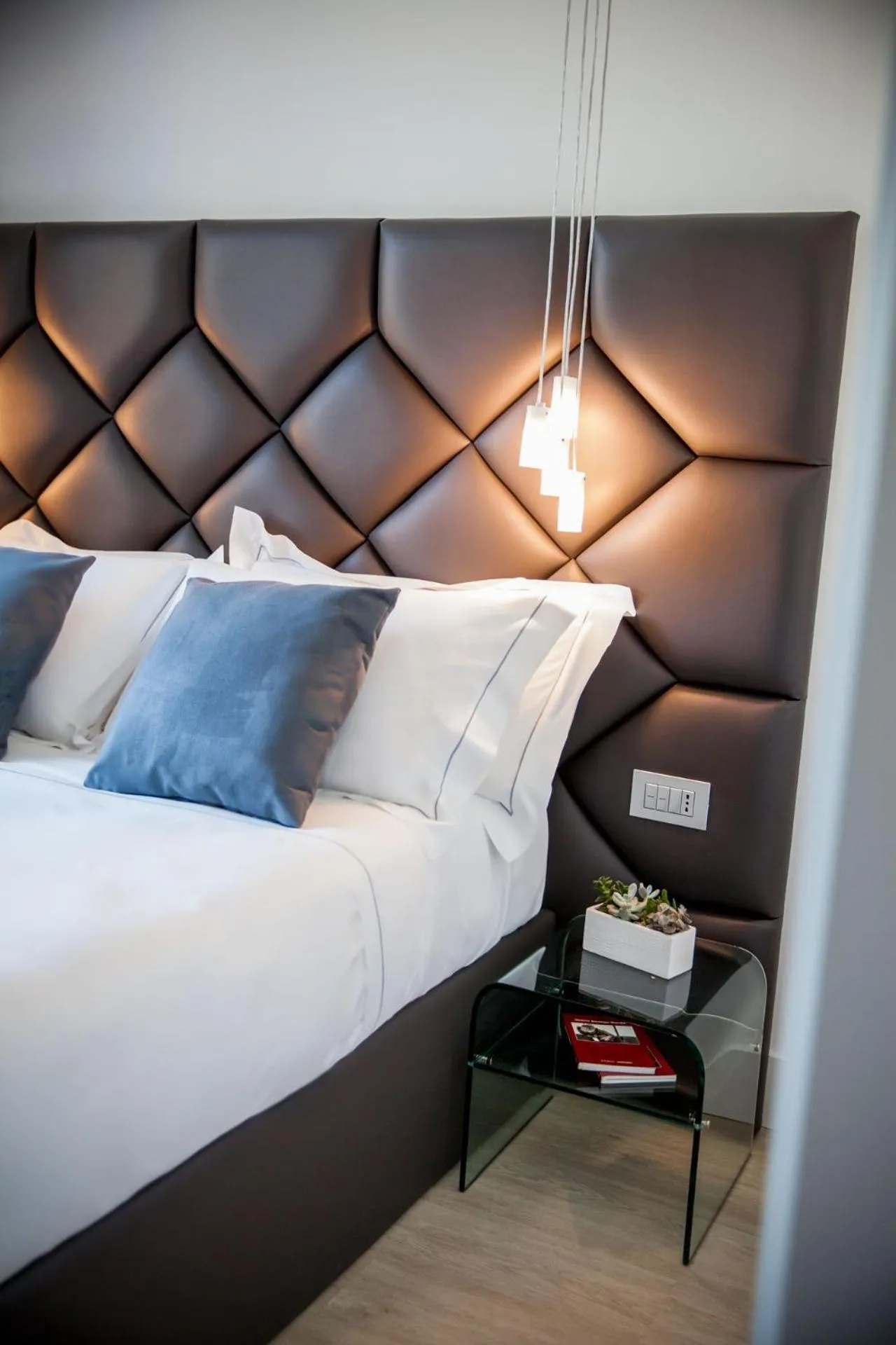 Bed in Sanremo Luxury Suites