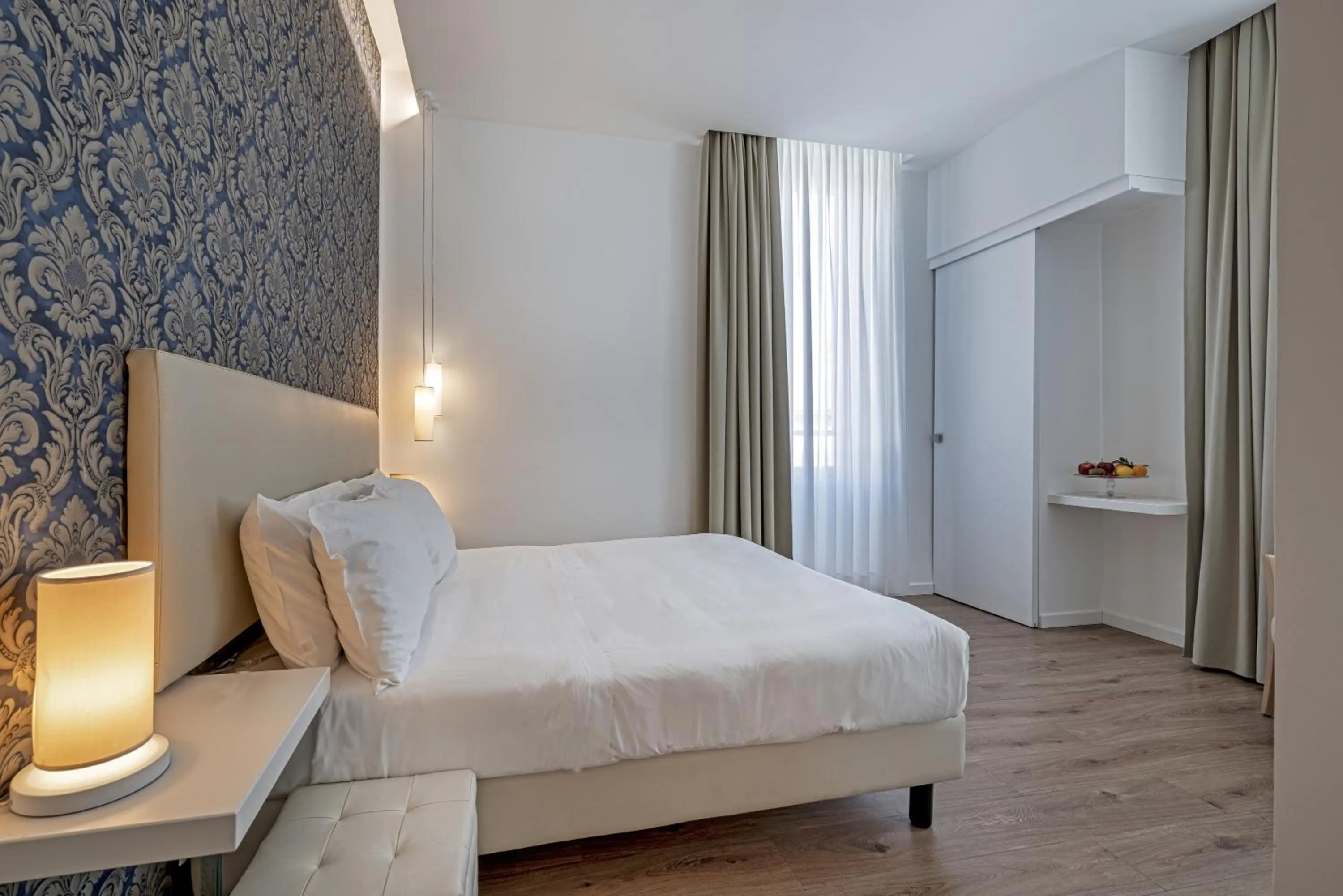 Bed in Sanremo Luxury Suites