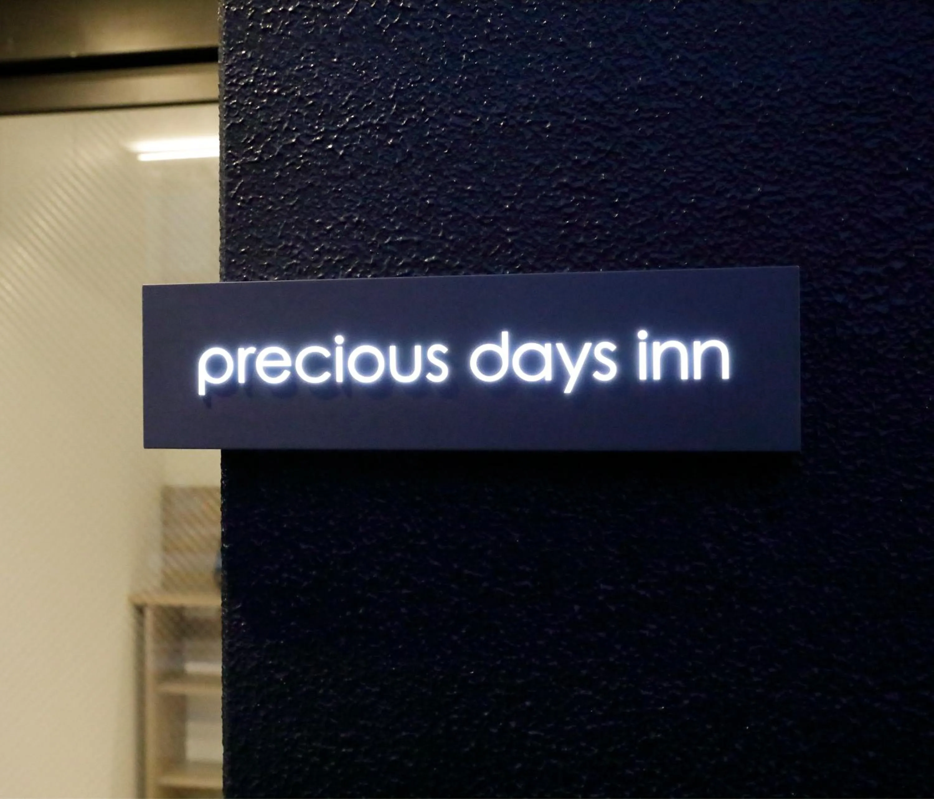 Property logo or sign in precious days inn