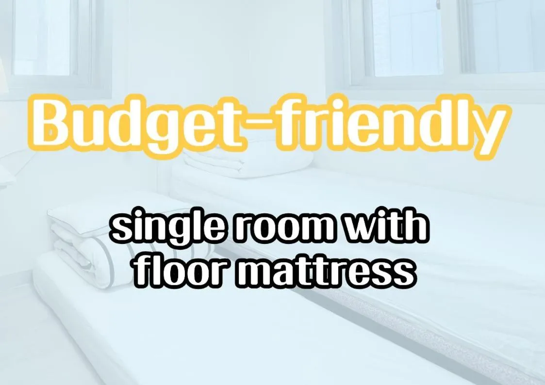 Text overlay, Bed in W Premium Guesthouse Incheon airport