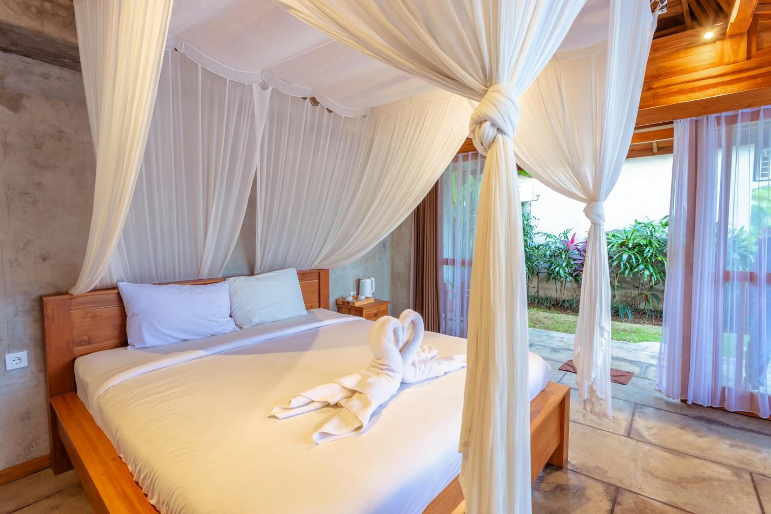 Bed in Kubu D'Carik Villa & Bungalow by ecommerceloka