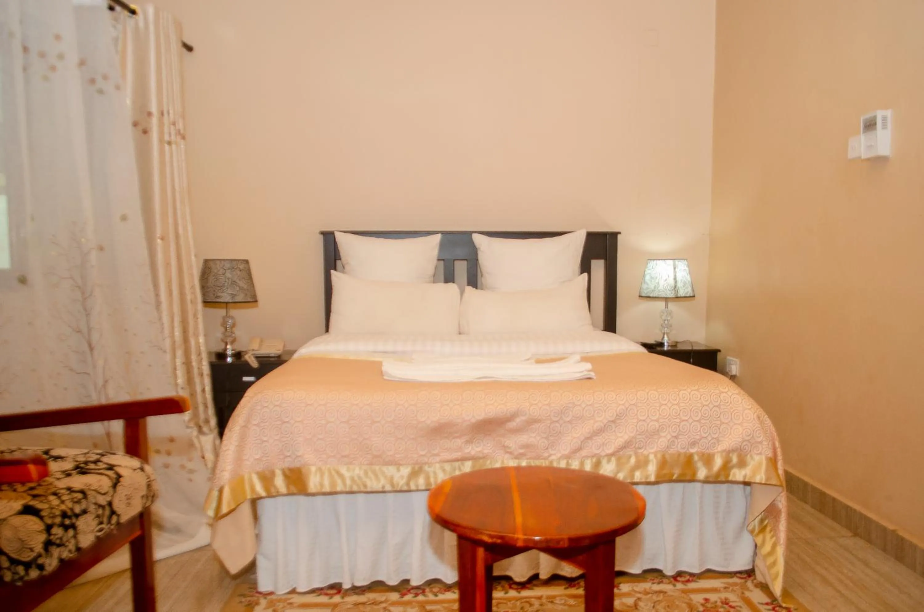 Bed in ROYAL SHALOM HOTEL