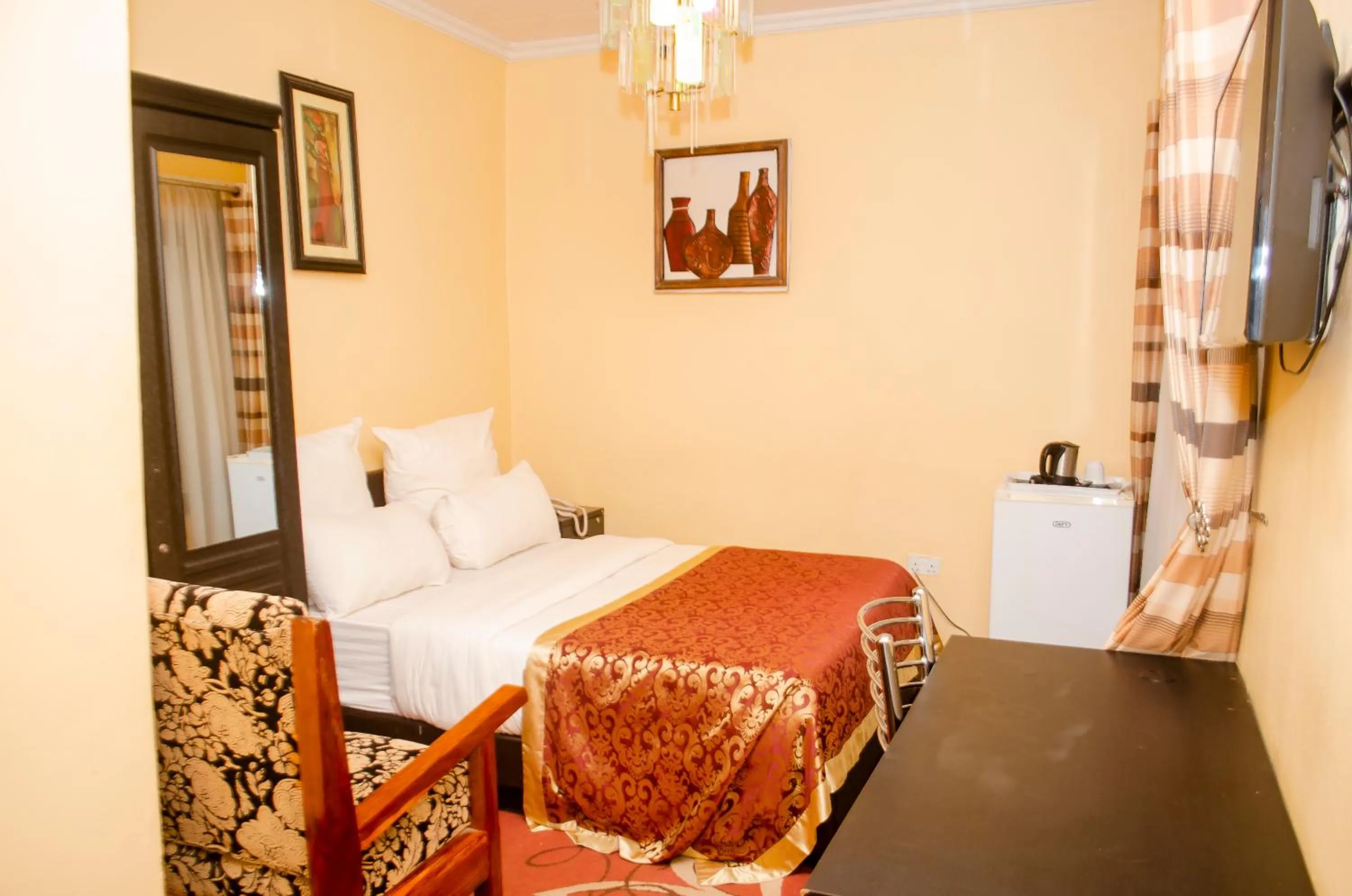 Bed in ROYAL SHALOM HOTEL