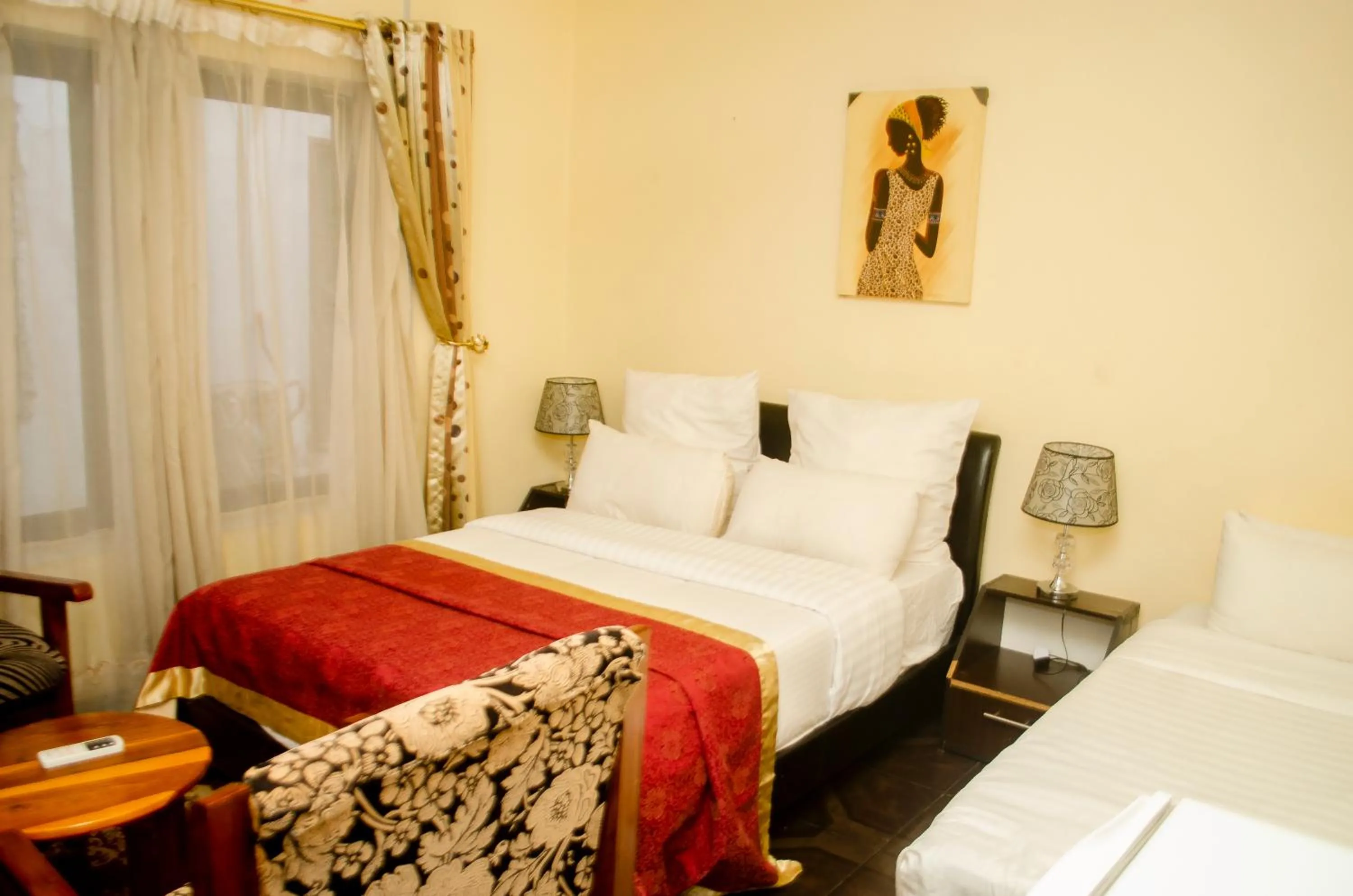 Bed in ROYAL SHALOM HOTEL