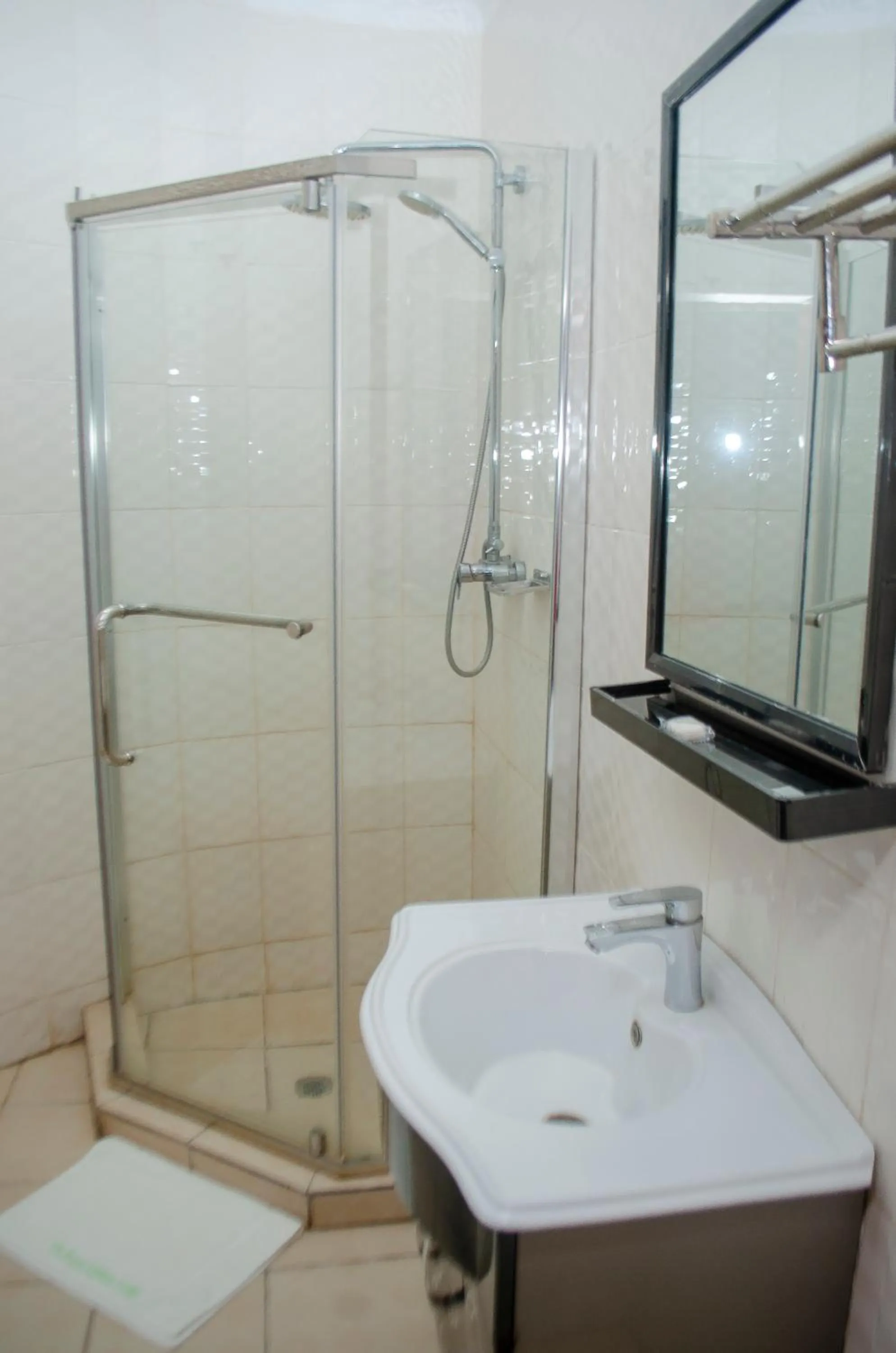 Shower in ROYAL SHALOM HOTEL