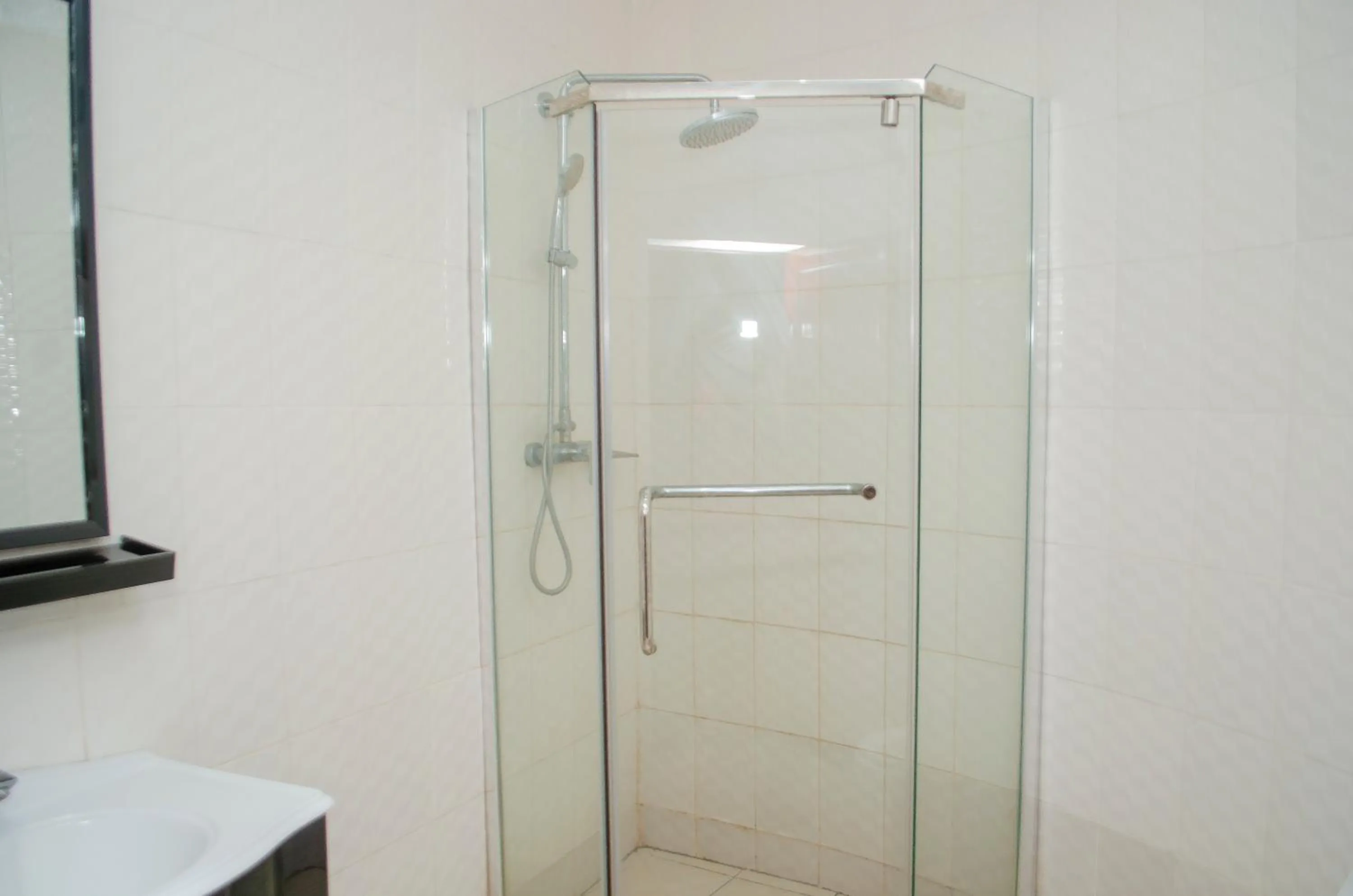 Shower in ROYAL SHALOM HOTEL