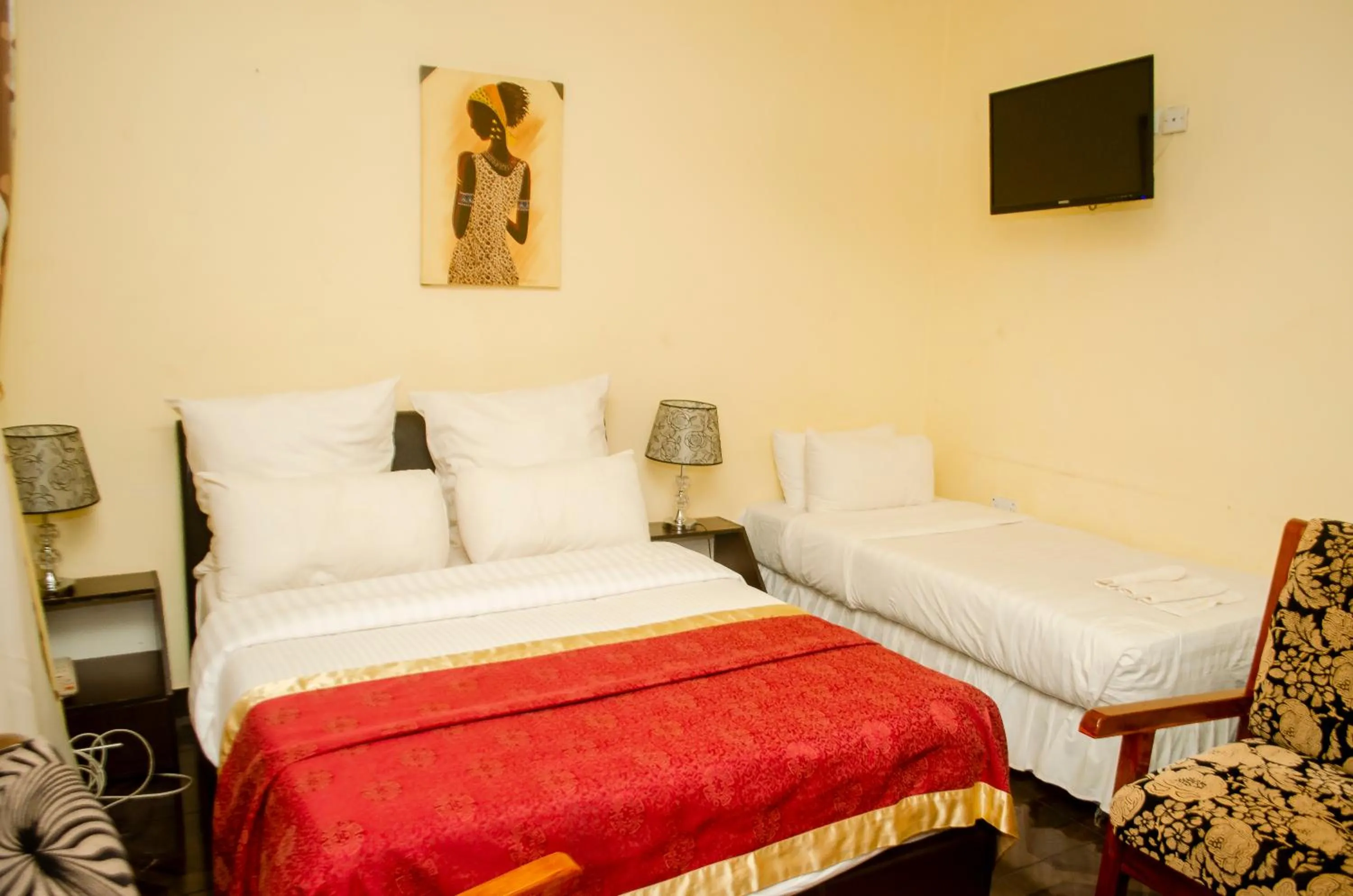 Bed in ROYAL SHALOM HOTEL