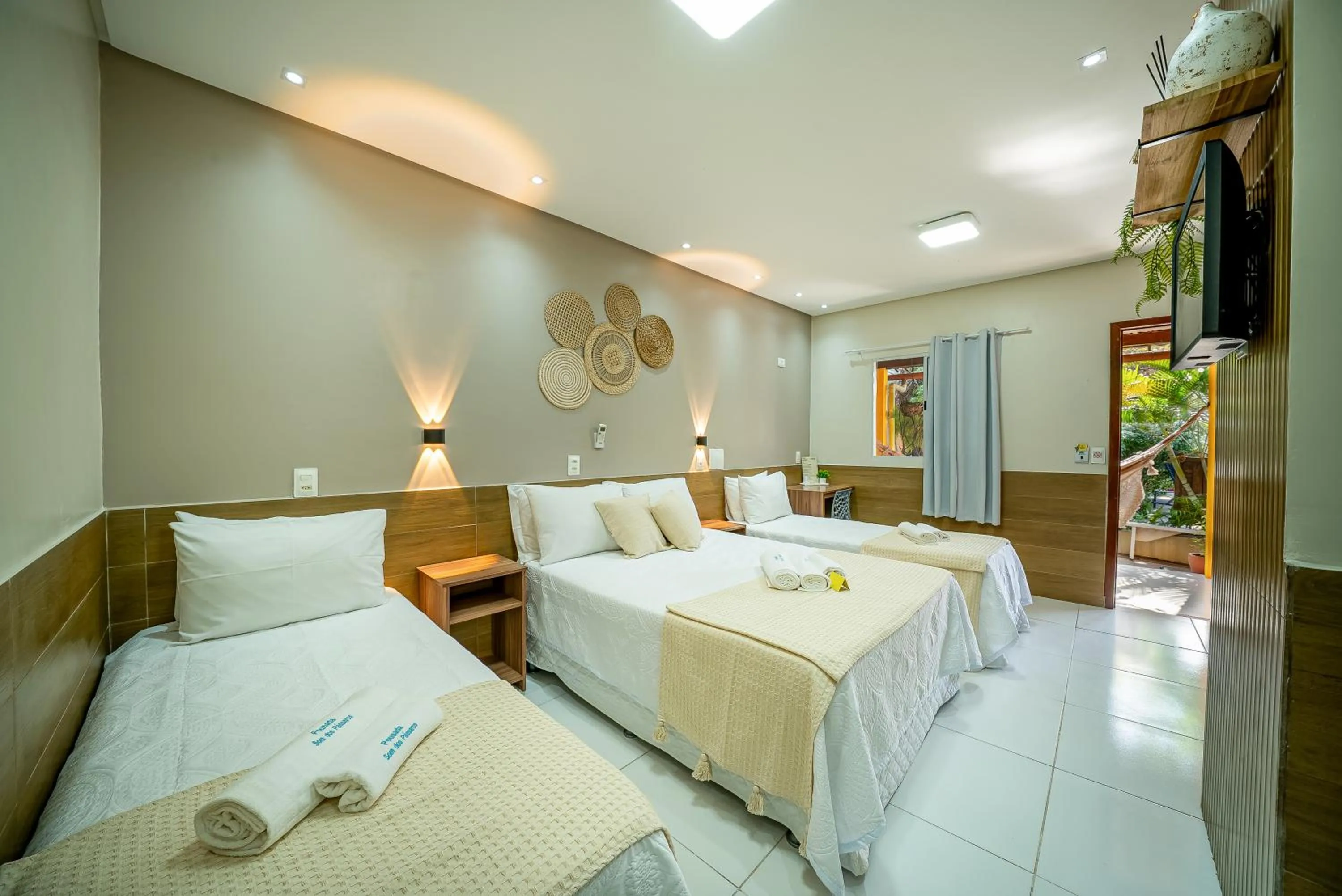 Bed in Pousada Som dos Pássaros