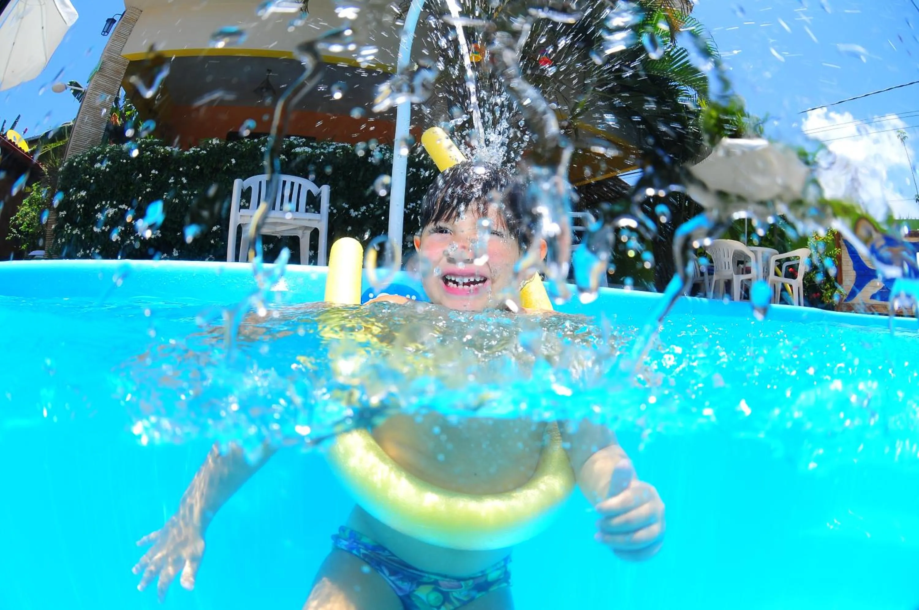 Swimming pool in Pousada Som dos Pássaros