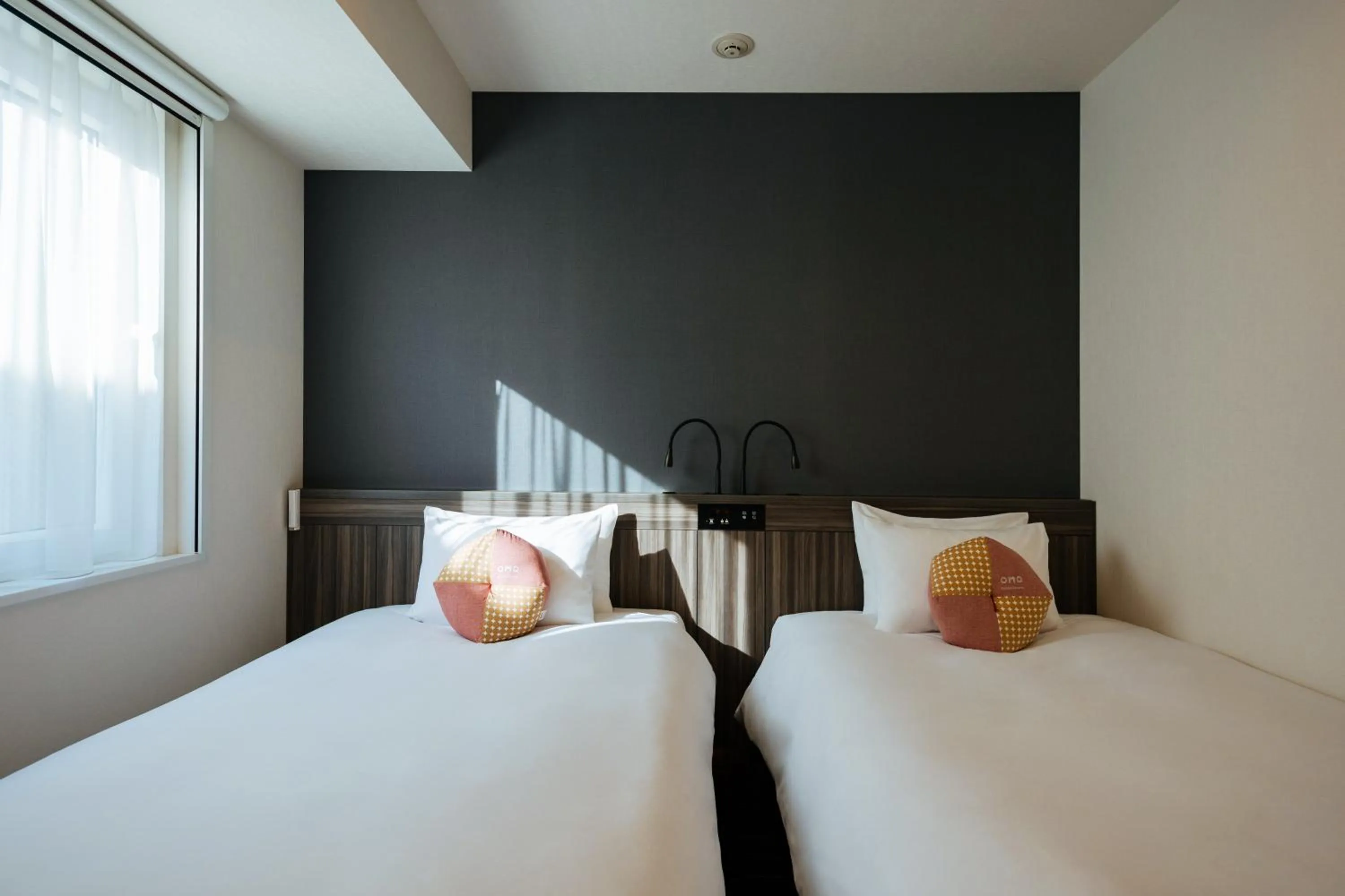 Bed in OMO3 Sapporo Susukino by Hoshino Resorts