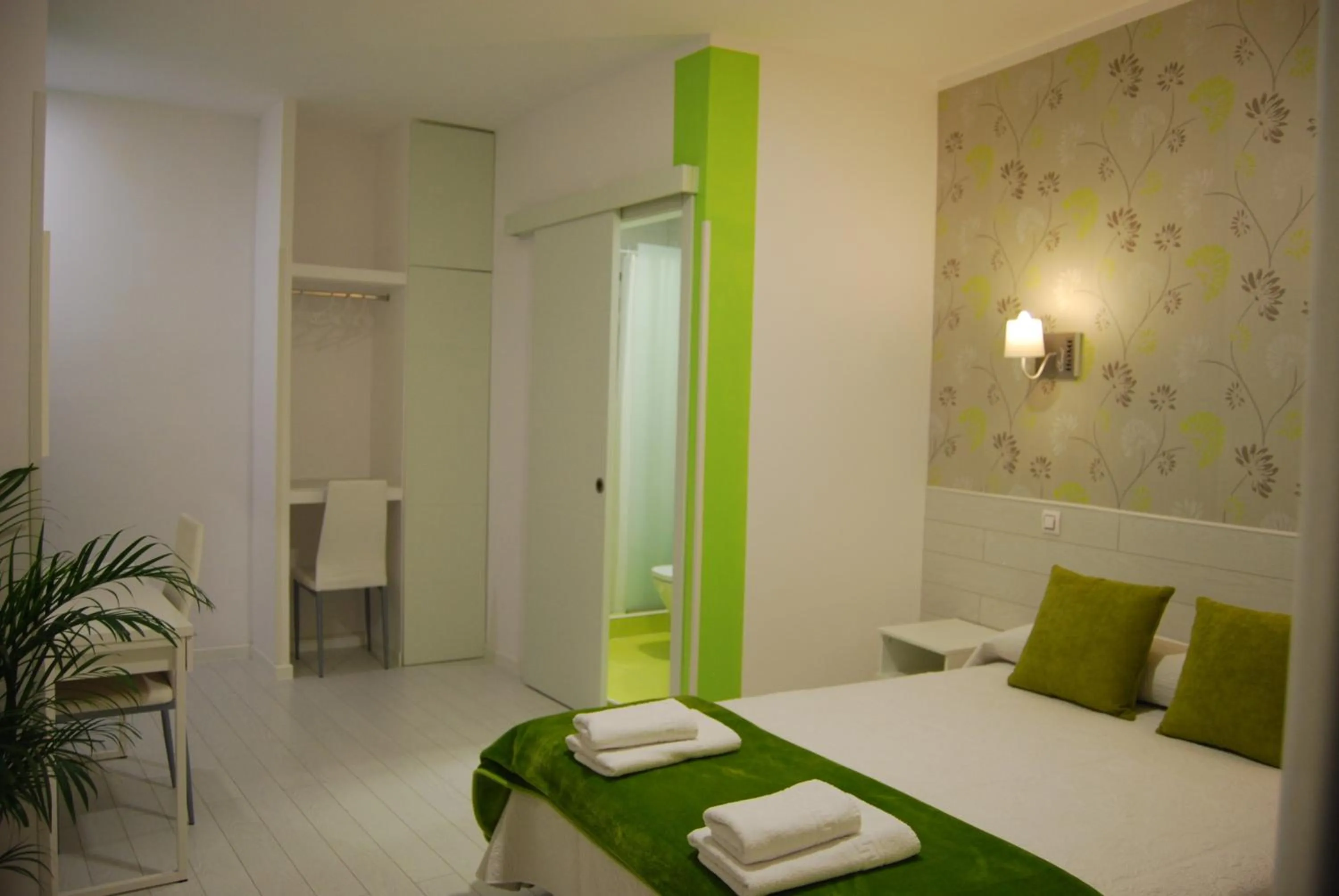 Bed in Hostal PETITE MAMAN