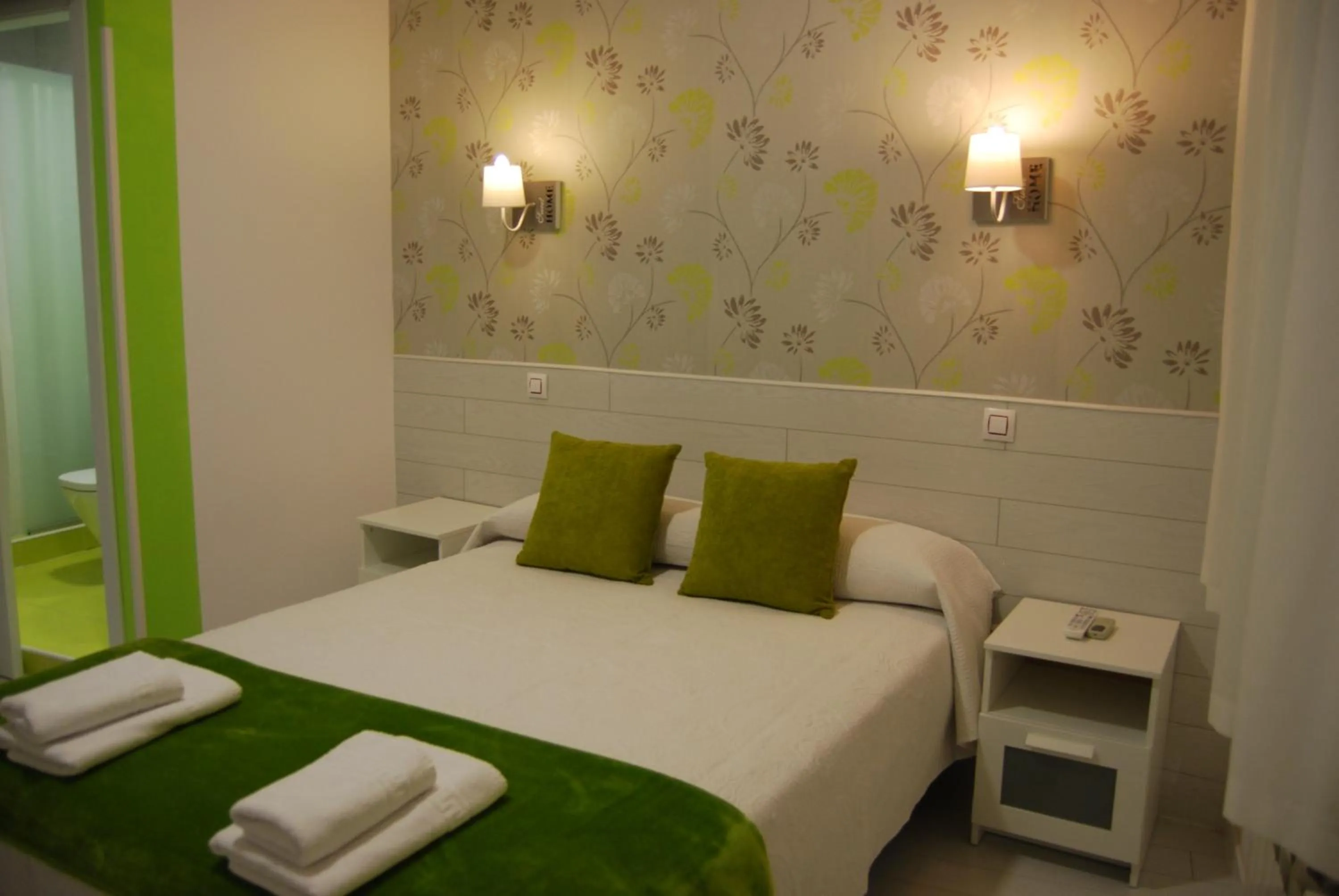 Bed in Hostal PETITE MAMAN