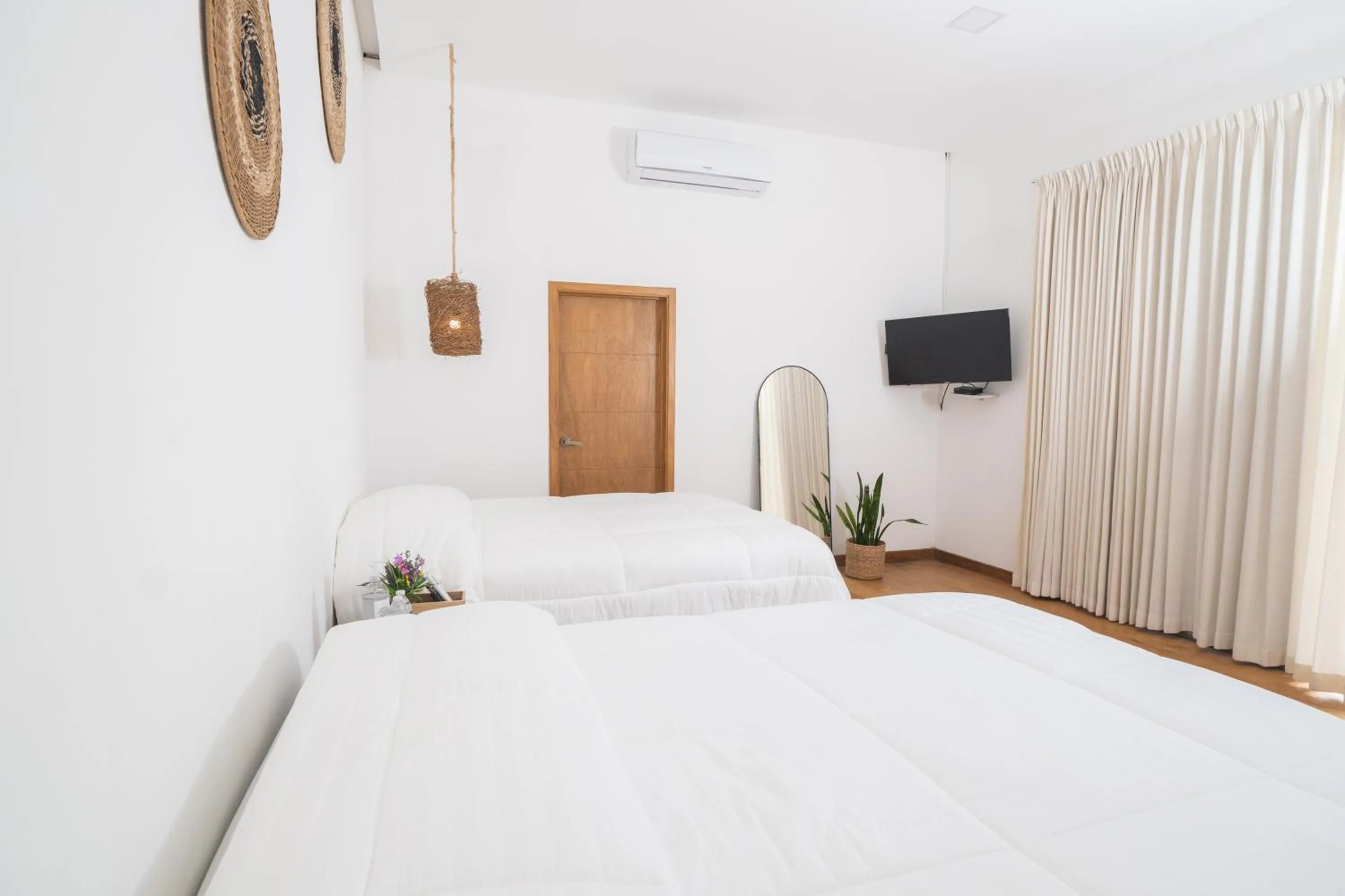 Bed in Equinoccio Hotel